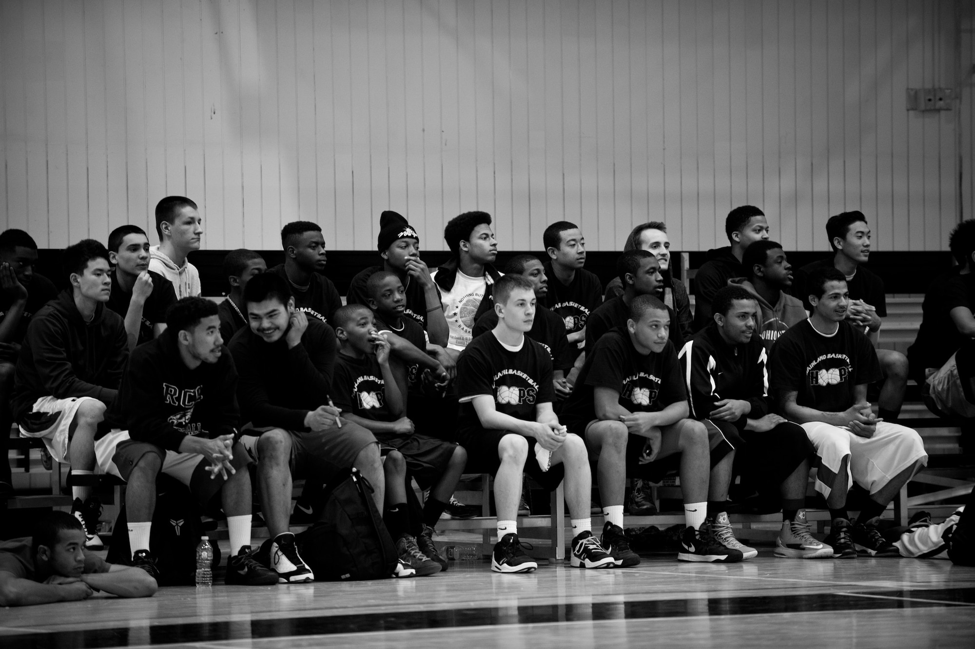 Youth between the ages of 12 and 20 watch the Women’s All Star Game at Yokota Air Base, Japan, April 12, 2013. The youth were part of the Mainland Basketball Association’s Basketball Camp which took place at Yokota throughout the week and stressed the importance of education through sports. (U.S. Air Force photo by Senior Airman Cody H. Ramirez/Released)