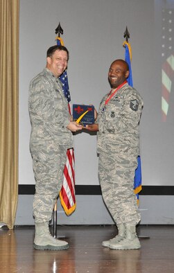 NELLIS AIR FORCE BASE, Nev. -- (Right) Dwayne Jackson, 926th Force Support Squadron, receives the award for the 926th Group Civilian Category III of the Year from Col. John Breeden, 926th Group commander, here April 6. (U.S. Air Force photo/Maj. Jessica Martin)