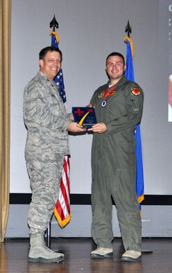 NELLIS AIR FORCE BASE, Nev. -- (Right) Maj. Christopher, 78th Attack Squadron, receives the award for 926th Group Officer Traditional Reservist of the Year from Col. John Breeden, 926th Group commander, here April 6. (U.S. Air Force photo/Maj. Jessica Martin)