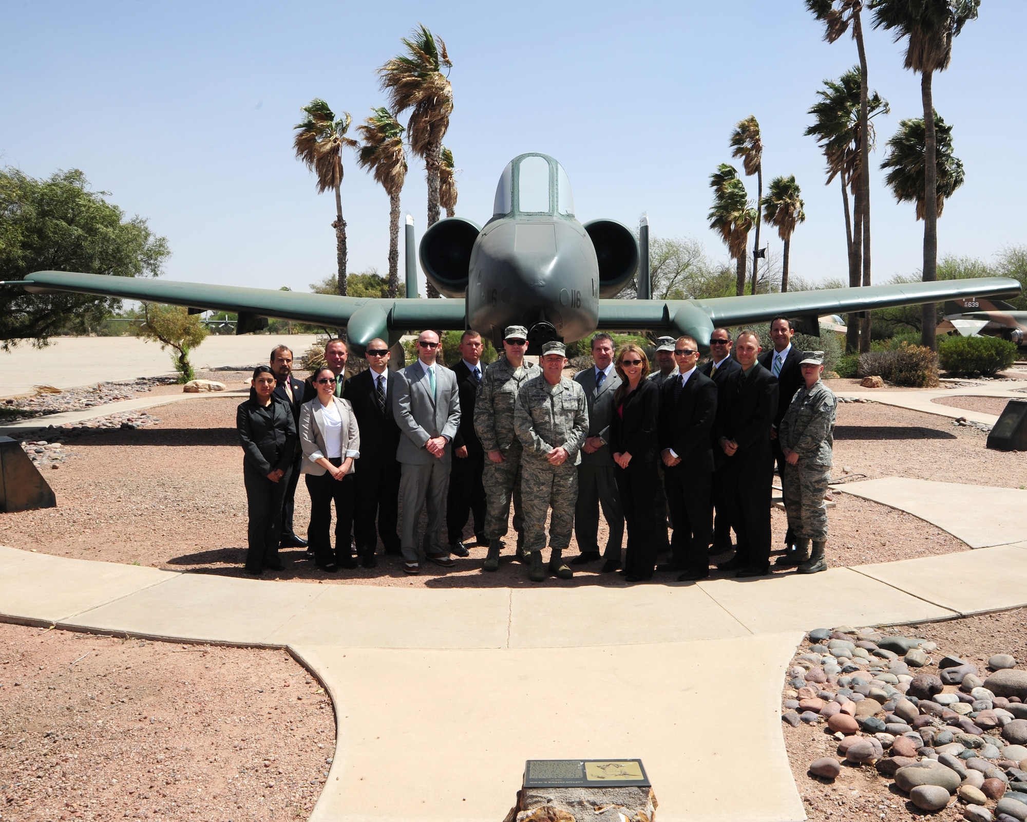 Brig. Gen. Kevin J. Jacobsen, Air Force Office of Special Investigations commander, which is headquartered at Quantico, Va., poses for a group photo with Desert Lightning Team OSI members at Davis-Monthan Air Force Base, Ariz., April 8, 2013.