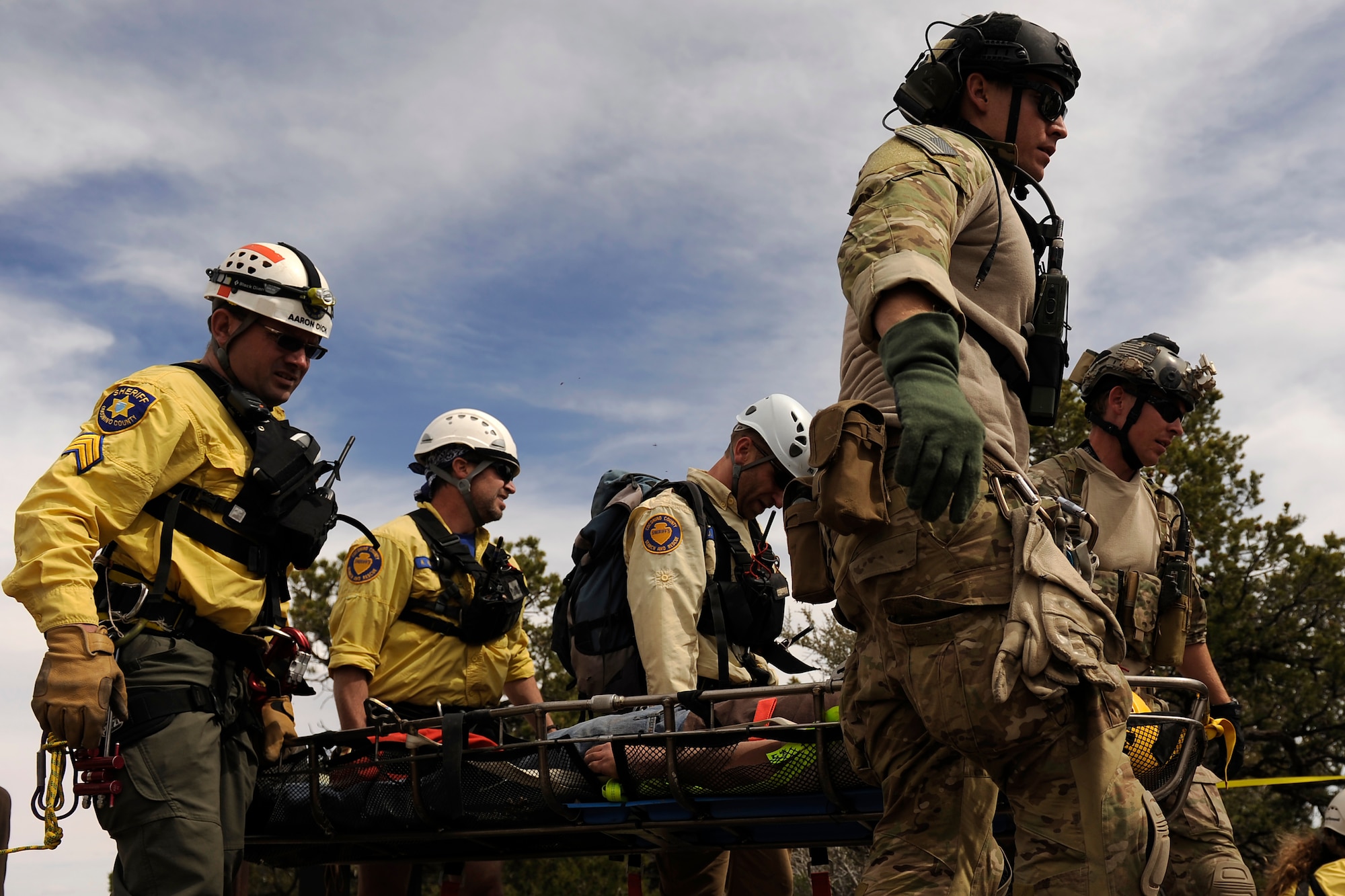 U.S. Air Force Pararescuemen, National Park Service Ranger and local fire and rescue crews participated in a mass causality exercise April 13, 2013 at the Grand Canyon, Ariz. during Angel Thunder 2013. Angel Thunder is the largest joint service, multinational, interagency combat search and rescue exercise designed to train personnel recovery assets using a variety of scenarios to simulate deployment conditions and contingencies. (U.S. Air Force photo by Staff Sgt. Tim Chacon)