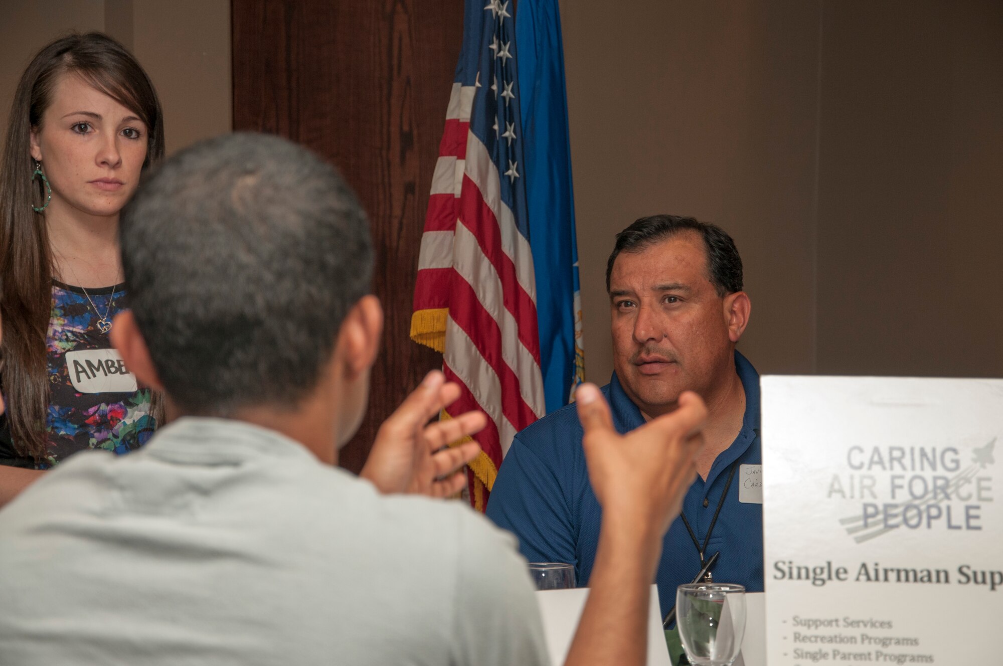 Participants at the Caring for People Forum discuss issues regarding single airman support at Club XL on Laughlin Air Force Base, Texas, April 10, 2013. The forum is designed to give participants a chance to discuss their concerns on several topics, including family support, deployment support, spouse communication, health and wellness, housing and many more. (U.S. Air Force photo/Airman 1st Class John Partlow)