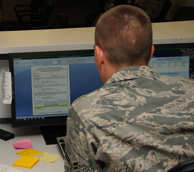 Airman 1st Class James Mansolo, 2nd Comptroller Squadron, reviews a separation form on Barksdale Air Force Base, La., April 15, 2013. The form is used for Airmen who are separating from the Air Force. The finance section can assist with issues regarding the Defense Travel System, Government Travel Cards, LeaveWeb and My-Pay. (U.S. Air Force photo/Senior Airman Sean Martin)