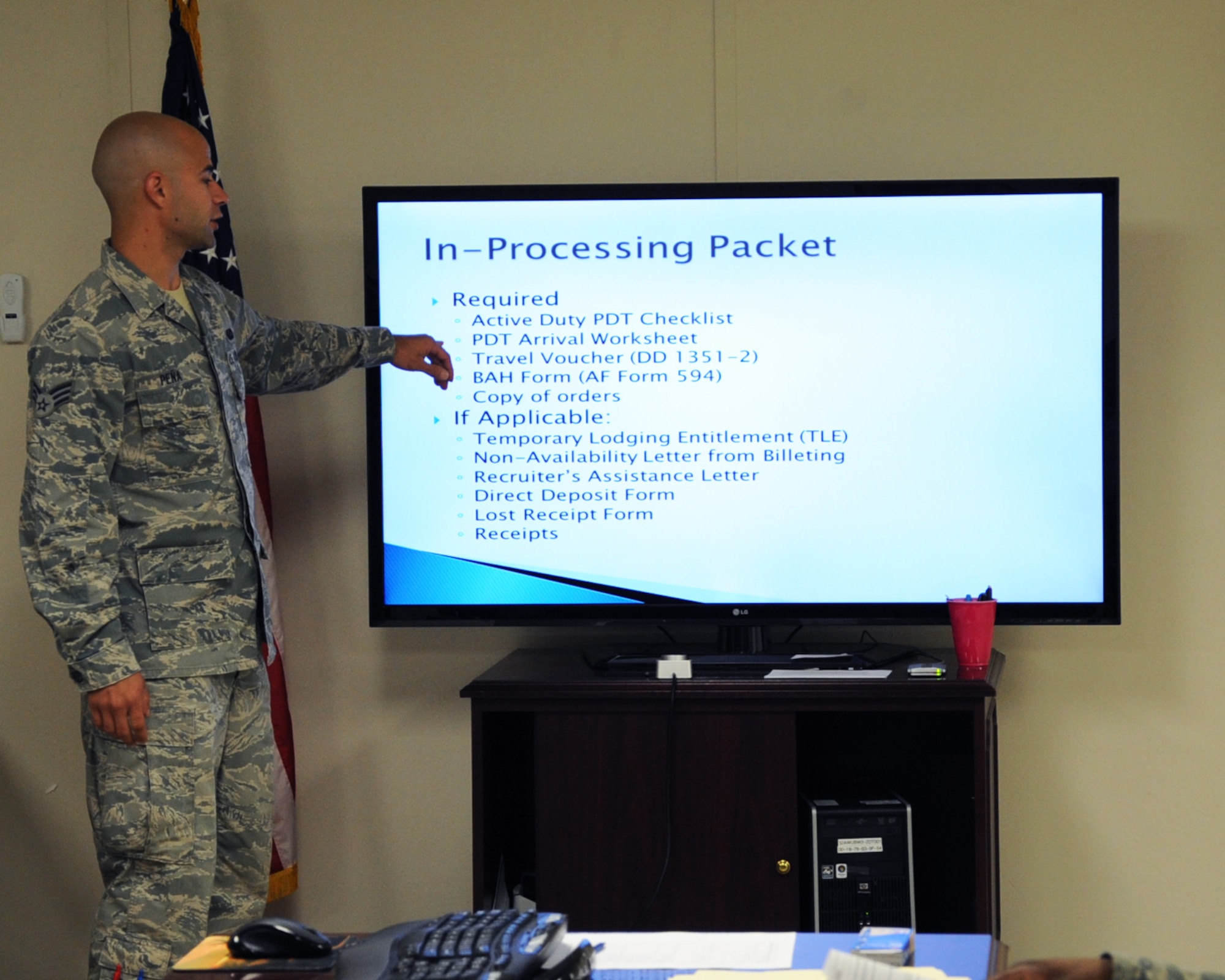 Senior Airman Luis Pena, 2nd Comptroller Squadron, gives an in-processing brief on Barksdale Air Force Base, La., April 15, 2013. The brief is used to help Airmen with their travel vouchers and is given every Monday, Wednesday and Friday at 1 p.m. (U.S. Air Force photo/Senior Airman Sean Martin)