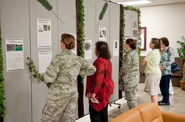 Members of Luke Air Force Base view posters describing genocides that have taken place since World War II. The exhibit, held in the Luke Air Force Base chapel, featured photos and stories from before, during and after World War II. (U.S. Air Force photo/Staff Sgt. C.J. Hatch)
