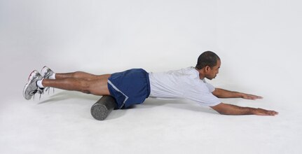 Quads Foam Roll
Lie face down on the floor with a foam roller positioned just above the knees. Slowly roll the body over the roller until it reaches the top of the thighs. Roll back and forth.
