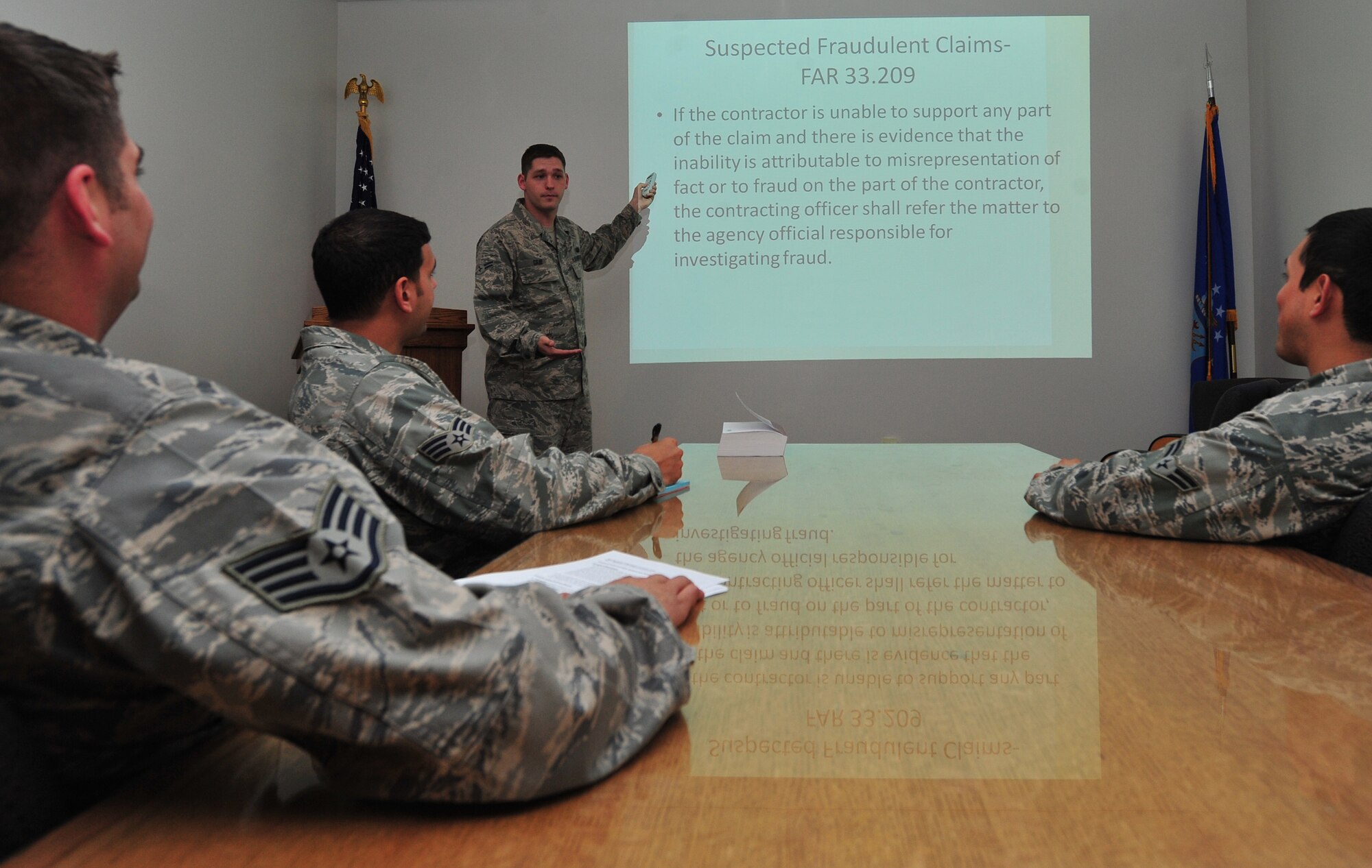 Airman First Class Phillip Gray, 22nd Contracting Squadron simplified acquisitions contracting specialist, gives a briefing April 12, 2013, McConnell Air Force Base, Kan. As a contracting specialist, Gray manages, performs and administers contracting functions for commodities, services and construction using simplified acquisition procedures, negotiation and other approved methods. He was chosen as the 22nd Air Refueling Wing spotlight performer for the week of April 8 to 12. (U.S. Air Force photo/ Airman 1st Class Colby L. Hardin)
