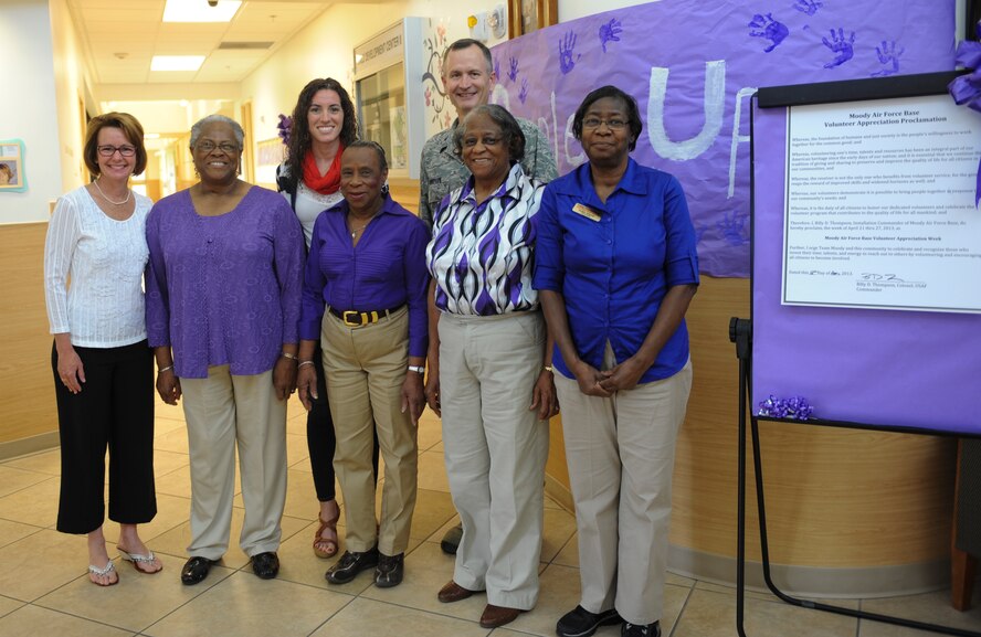 U.S. Air Force Col. Billy Thompson, 23d Wing commander, and wife, Julie Thompson, pose for a group photo with members of the Foster Grandparent Program at the Child Development Center April 12, 2013, at Moody Air Force Base, Ga. Thompson signed a proclamation for volunteer appreciation. (U.S. Air Force photo by Airman Alexis Grotz/Released)