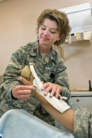 Capt. Debra Secrest, 99th Medical Operations Squadron chief of occupational therapy, fabricates a custom orthoplast splint April 3, 2013, at Nellis Air Force Base, Nev. Treatments for upper body extremities include splinting, strengthening exercises, sensory re-educating, modalities, and gross and fine motor coordination exercises. (U.S. Air Force photo by Senior Airman Matthew Lancaster)