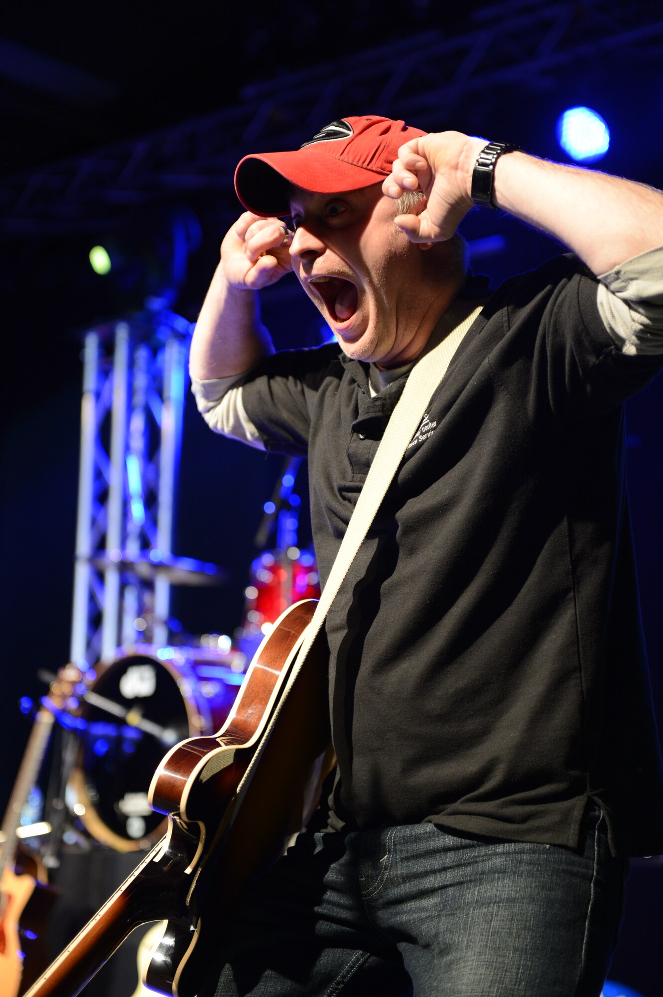 SPANGDAHLEM AIR BASE, Germany – Andrew Rice, 52nd Fighter Wing Force Support Squadron community center staff member, entertains the audience during the Imagination Movers concert April 11, 2013. The concert was free for children and their parents on Spangdahlem as part of a list of Month of the Military Child events throughout April. (U.S. Air Force photo by Airman 1st Class Kyle Gese/Released)