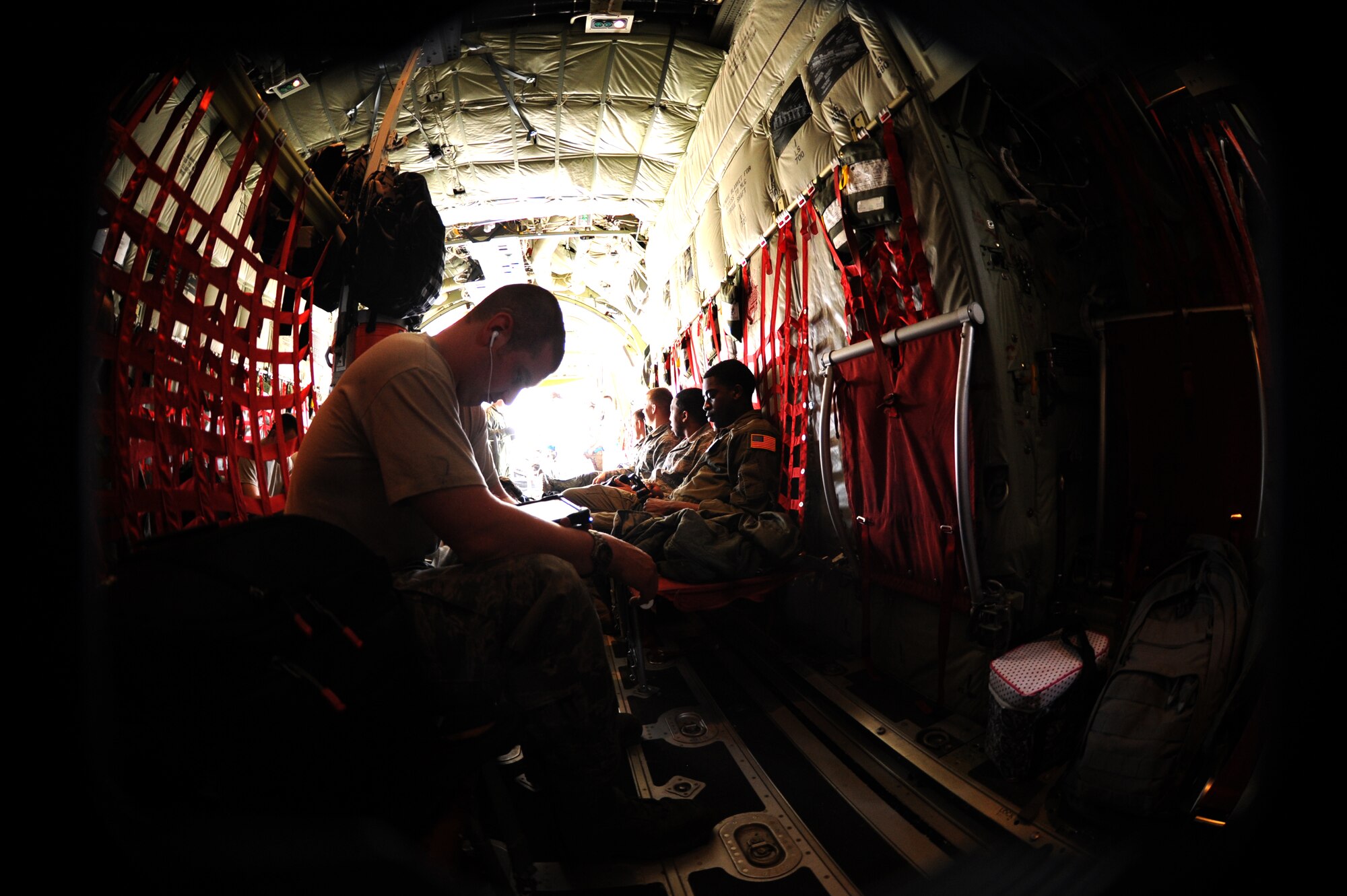 Staff Sgt. Dyllan Langley, 86th Aircraft Maintenance Squadron hydraulic systems technician, watches a video as the C130-J Super Hercules prepares to depart to Romania for Exercise Carpathian Spring, April 14, 2013, Ramstein Air Base, Germany. The exercise runs through April 21 and is designed for aircrews to train as well as help build a partnership capacity with Romanians. (U.S. Air Force photo/Airman 1st Class Hailey Haux)