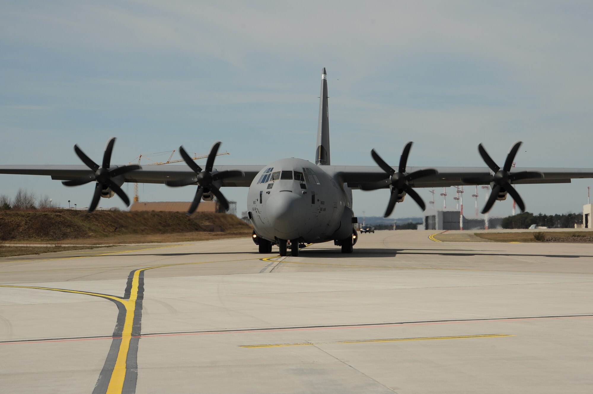 A C-130J Super Hercules taxis on the runway carrying Airmen to Romania to participate in Exercise Carpathian Spring, April 14, 2013, Ramstein Air Base, Germany. The exercise runs through April 21 and is designed for aircrews to train as well as help build a partnership capacity with Romanians. (U.S. Air Force photo/Airman 1st Class Hailey Haux)