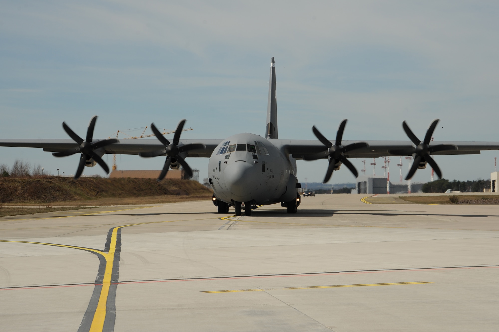 A C-130J Super Hercules taxis on the runway carrying Airmen to Romania to participate in Exercise Carpathian Spring, April 14, 2013, Ramstein Air Base, Germany. The exercise runs through April 21 and is designed for aircrews to train as well as help build a partnership capacity with Romanians. (U.S. Air Force photo/Airman 1st Class Hailey Haux)