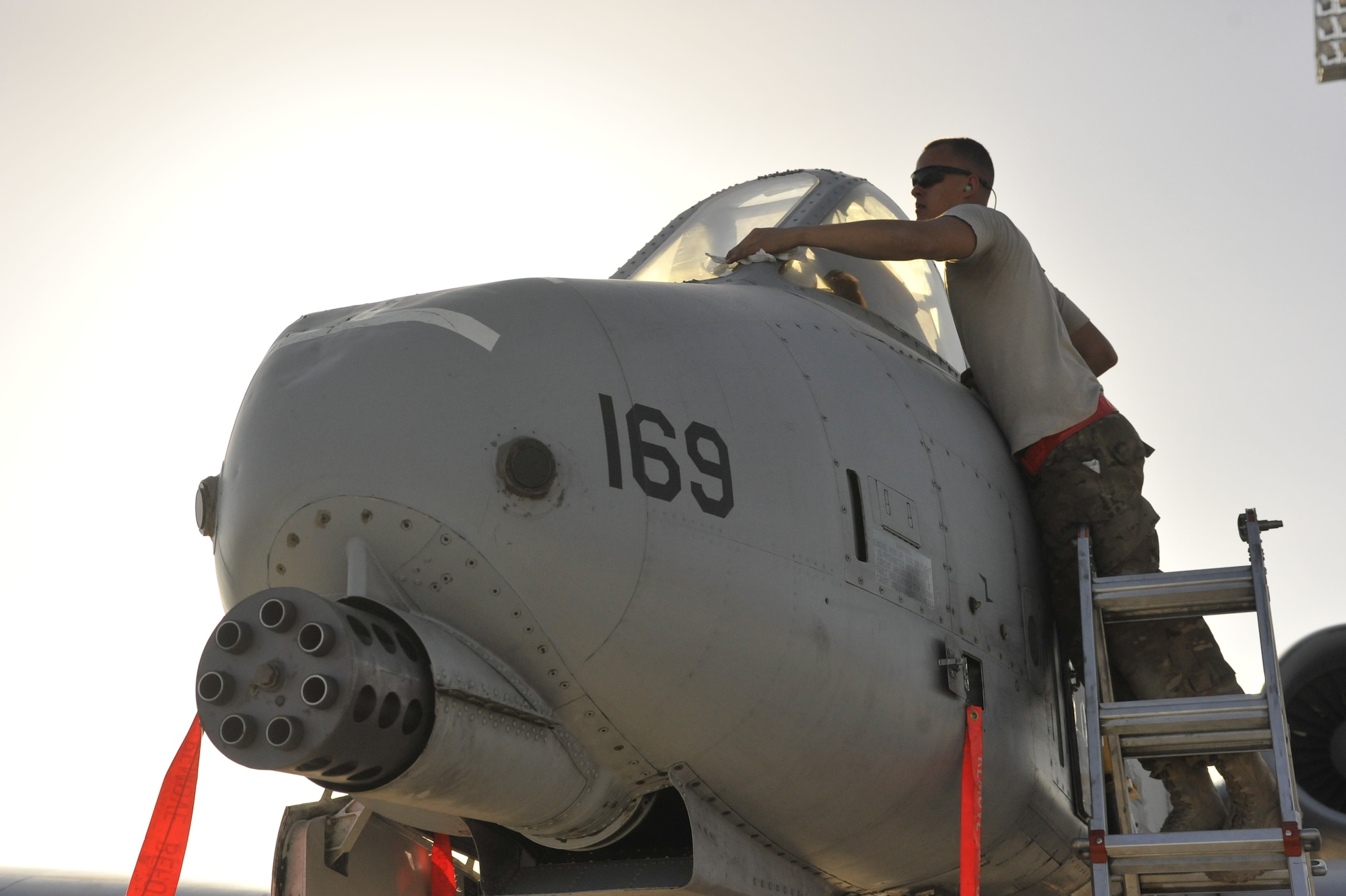 Staff Sgt. Chad Cole, 455th Expeditionary Aircraft Maintenance Squadron crew chief, gives an A-10 Thunderbolt II a last cleaning before its 7,800 mile flight back to the 355th Fighter Wing at Davis-Monthan Air Force Base, Ariz., from Bagram Airfield, Afghanistan. This Thunderbolt II was one of the last to leave Bagram Airfield on April 14, 2013 after a six-month deployment flying more than 110,000 hours. (U.S. Air Force Photo/Master Sgt. Jun Kim)
