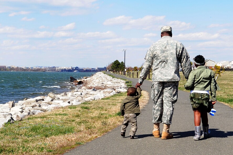 Staff Sgt. Seddrick Crusoe, White House Communications Agency, walks along the Potomac River with his daughter, Caury, and son, Macen, April 3, 2013, at Joint Base Anacostia-Bolling, D.C. (U.S. Air Force photo by Senior Airman Steele C. G. Britton)