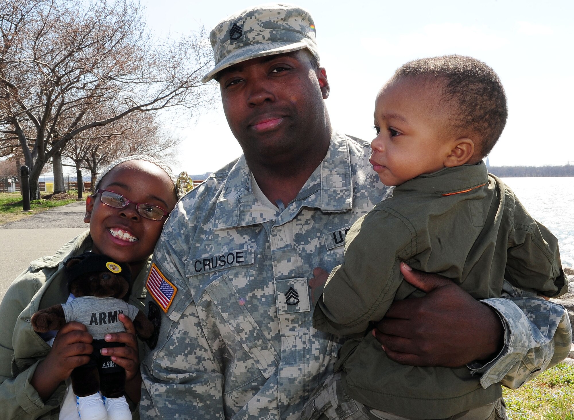 Staff Sgt. Seddrick Crusoe, White House Communications Agency, spends time with his daughter, Caury, and son, Macen, near the Potomac River, April 3, 2013, at Joint Base Anacostia-Bolling, D.C. (U.S. Air Force photo by Senior Airman Steele C. G. Britton)