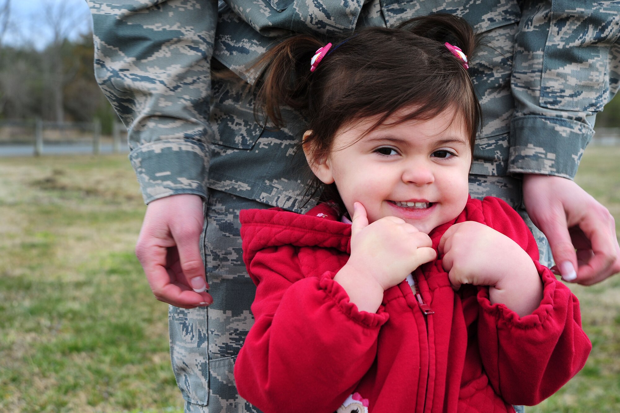 Ella Green stands with her mother, Staff Sgt. Nicole Green, Air Force District of Washington, March 28, 2013, at Freedom Park, Joint Base Andrews, Md. (U.S. Air Force photo by Senior Airman Steele C. G. Britton)