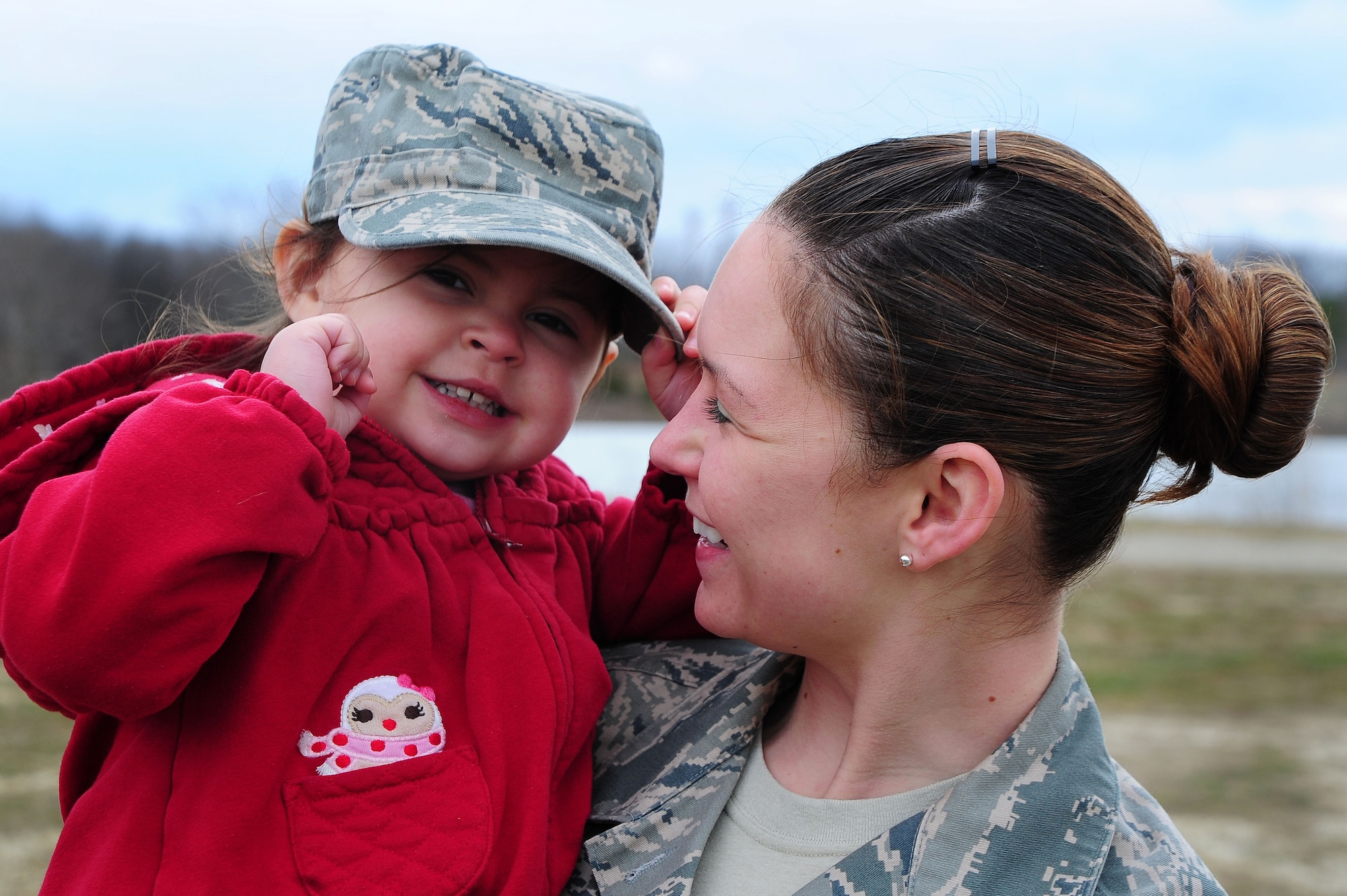 Staff Sgt. Nicole Green, Air Force District of Washington Protocol NCO, smiles at her daughter, Ella, March 28, 2013, at Joint Base Andrews, Md. (U.S. Air Force photo by Senior Airman Steele C. G. Britton) 