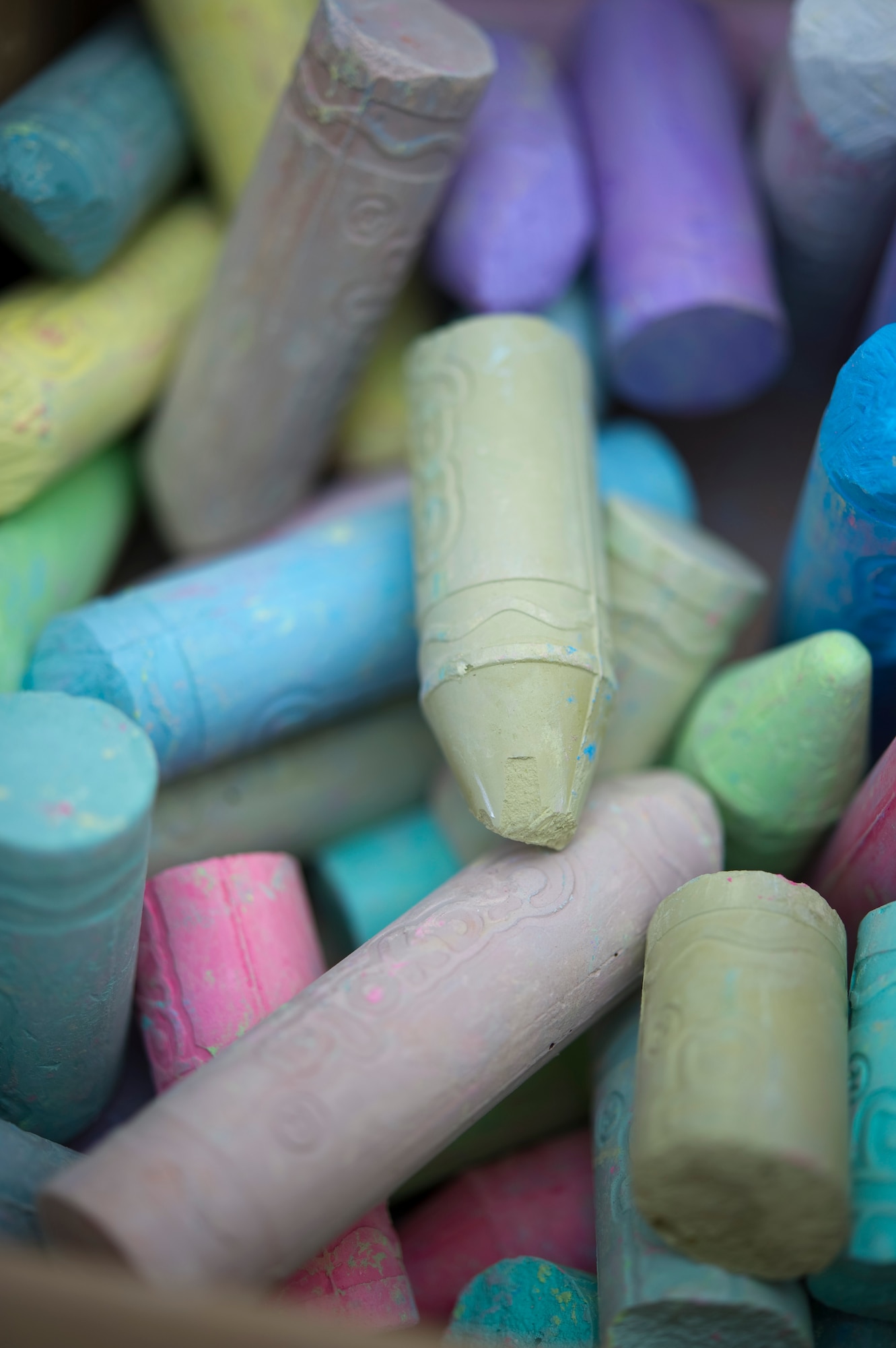 YOKOTA AIR BASE, Japan – Boxes of chalk line the sidewalk for children to use outside the base library at Yokota Air Base, Japan, April 15, 2013. During the Month of the Military Child, children have had the opportunity to participate in various events such as story time with base leadership and arts and crafts. (U.S. Air Force photo by Staff Sgt. Chad C. Strohmeyer/Released)