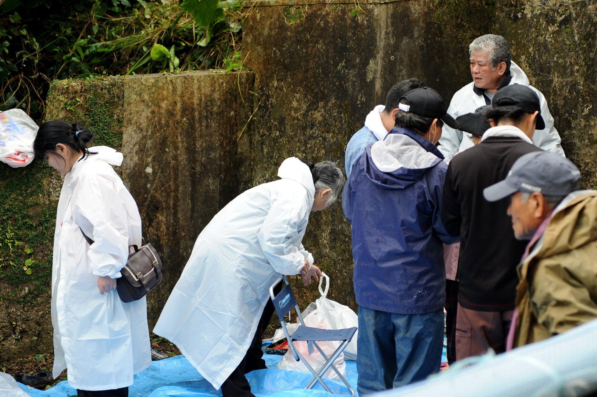 Local Okinawans prepare to worship and feast at sacred sites on Kadena Air Base, Japan, April 14, 2013. Locals participated in Seimeisai, an annual religious event where Okinawans go to the graves of their ancestors and feast in offering form. More than 400 Okinawans were escorted to sacred sites in the munitions storage area by 18th Munitions Squadron personnel. (U.S. Air Force photo by Airman 1st Class Hailey R. Davis/Released)