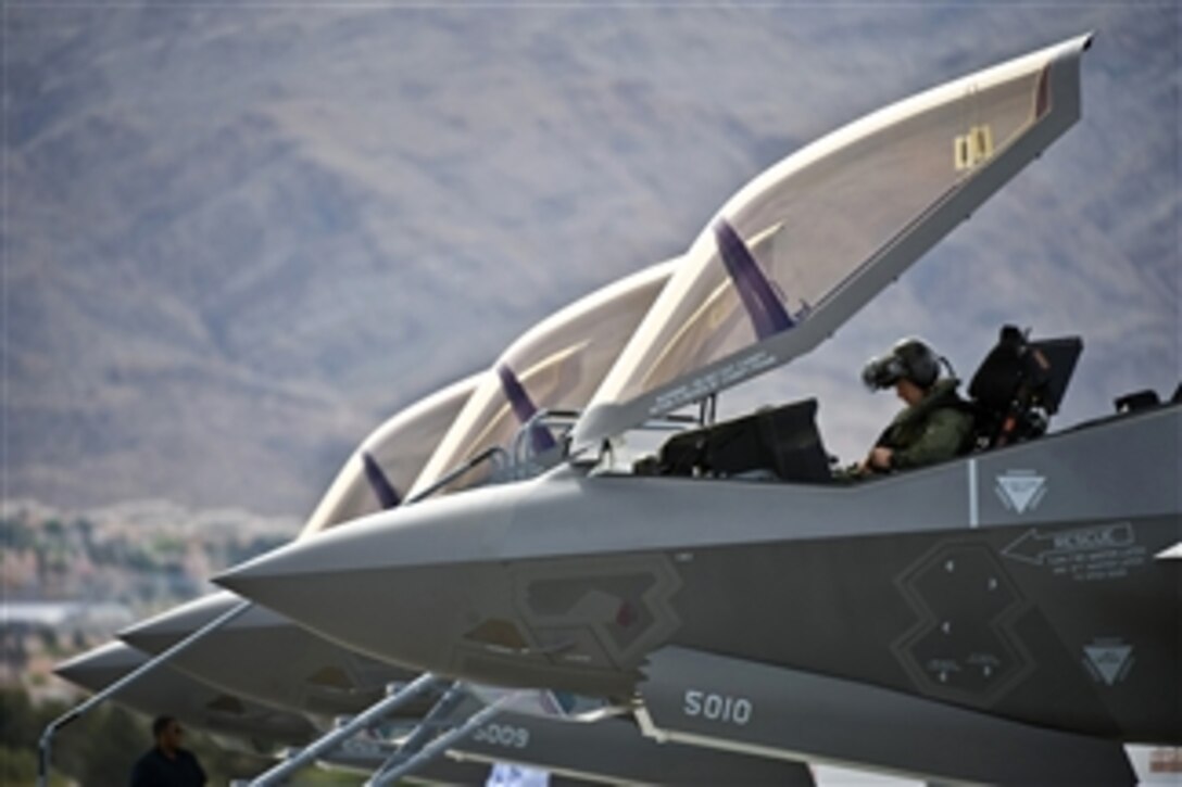 U.S. Air Force Capt. Brad Matherne conducts preflight checks inside an F-35A Lightning II at Nellis Air Force Base, Nev., before a training mission on April 4, 2013.  The F-35A will be integrated into advanced training programs such as the U.S. Air Force Weapons School, Red and Green Flag exercises.  Matherne is a pilot assigned to the 422nd Test and Evaluation Squadron.  