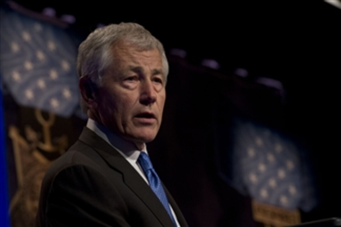 Secretary of Defense Chuck Hagel speaks at the ceremony to induct the nation’s latest Medal of Honor recipient Army Chaplain (Capt.) Emil J. Kapaun into the Pentagon’s Hall of Heroes on April 12, 2013.   Chaplain Kapaun died in a prisoner of war camp during the Korean War while counseling and saving countless fellow service members.  