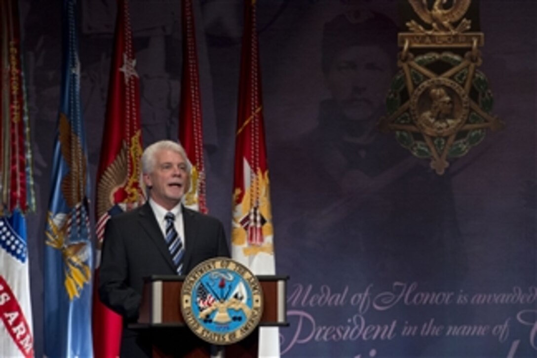 Ray Kapaun speaks at the ceremony to induct the nation’s latest Medal of Honor recipient Army Chaplain (Capt.) Emil J. Kapaun into the Pentagon’s Hall of Heroes on April 12, 2013.   Chaplain Kapaun died in a prisoner of war camp during the Korean War while counseling and saving countless fellow service members.  Ray is Chaplain Kapaun's nephew and represented his uncle during the ceremony.  