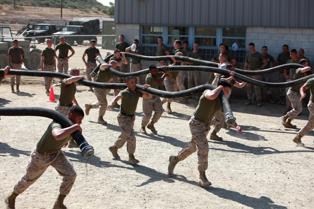 Marines with Bulk Fuel Company, 7th Engineer Support Battalion, 1st Marine Logistics Group, begin a hose run during the Bulk Fuel Challenge aboard Camp Pendleton, Calif., Apr. 12, 2013. Each platoon in Bulk Fuel Company competed in a series of timed bulk fuel-themed events.