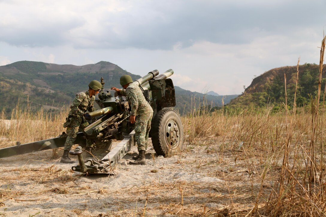 Armed Forces of the Philippines Marines fire an M101 105 mm howitzer during artillery live-fire training April 12 at Crow Valley, Republic of the Philippines. The Philippine and U.S. Marines took turns demonstrating their equipment, according to U.S. Marine Capt. Ricardo R. Bitanga, the executive officer for Alpha Battery, 1st Battalion, 10th Marine Regiment, 2nd Marine Division, II Marine Expeditionary Force. The training is part of exercise Balikatan 2013, an annual bilateral exercise in its 29th iteration, which provides a venue for Armed Forces of the Philippines and U.S. military forces to develop and continue to enhance interoperability across a wide range of military actions. 
