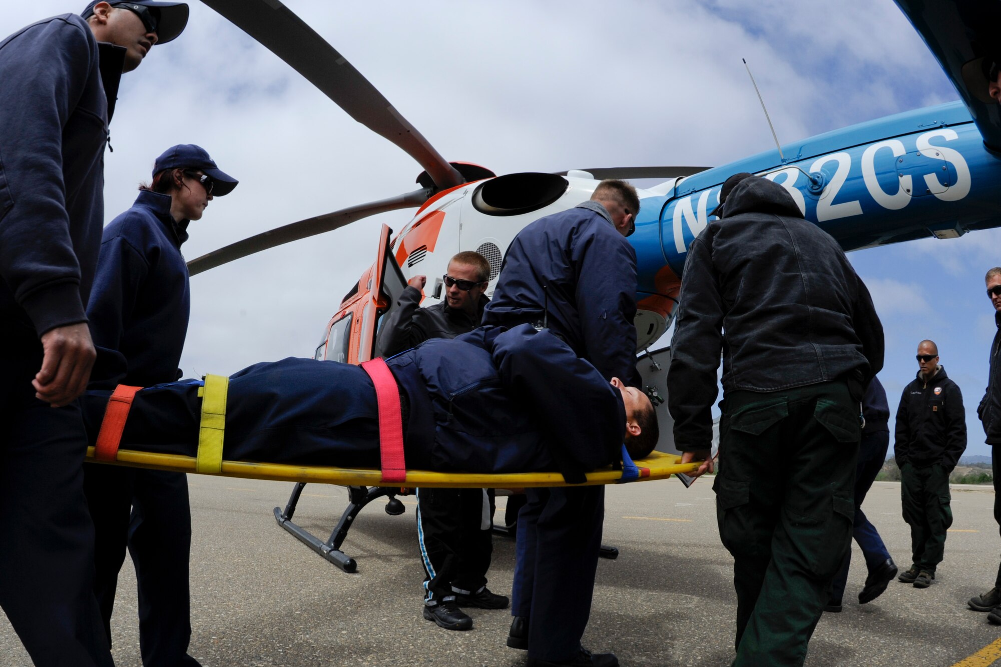 LOMPOC, Calif. – Members from the Vandenberg fire department practice loading a patient during hands on training at the Lompoc Airport Thursday, April 11, 2013. Vandenberg Fire Department members trained with the CALStar flight crew to ensure patients can get to a trauma unit within the 60 minute window known as the golden hour. (U.S. Air Force photo/Airman Yvonne Morales)