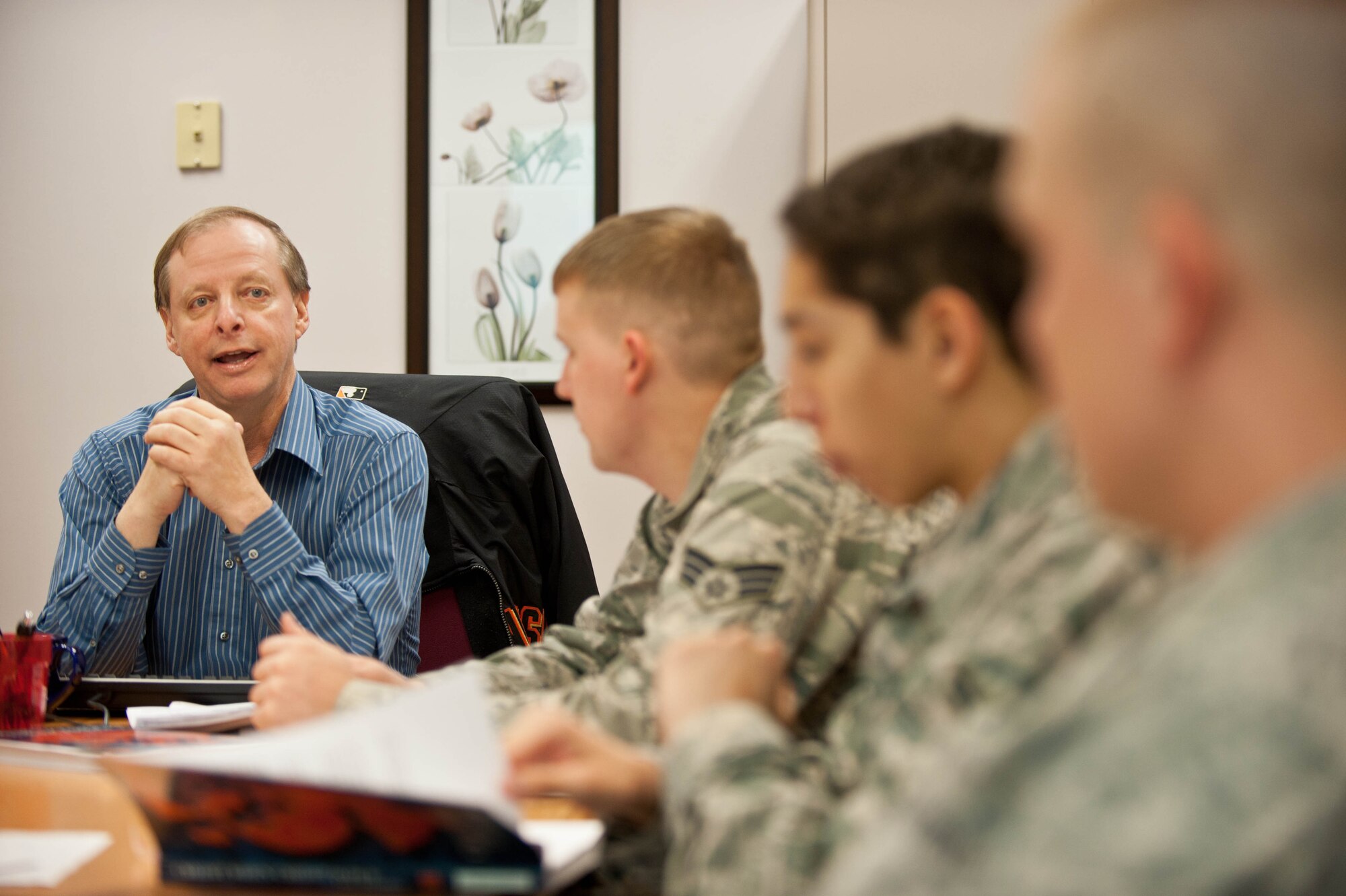 Terry Mills, Consumer Credit Counseling Service education and community outreach manager, counsels Airmen during a financial aid course called “Credit When Credit is Due” conducted at the Airman and Family Readiness Center at Ellsworth Air Force Base, S.D., April 4, 2013. “Credit When Credit is Due” is a gateway financial seminar for anyone interested in learning more about saving, borrowing money, investing, creating a spending plan, and generally being financially responsible. (U.S. Air Force photo by Airman 1st Class Zachary Hada/Released)