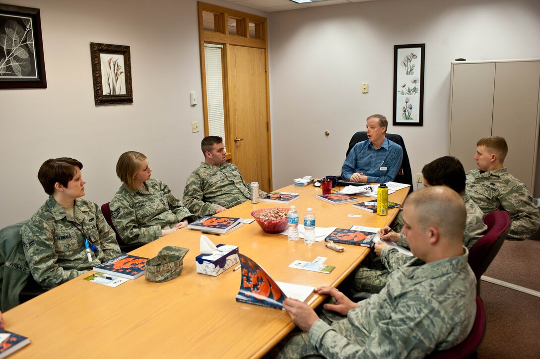 Terry Mills, Consumer Credit Counseling Service education and community outreach manager, counsels Airmen during a financial aid course called “Credit When Credit is Due” conducted at the Airman and Family Readiness Center at Ellsworth Air Force Base, S.D., April 4, 2013. The course provided financial guidance on topics including setting up a budget, managing auto loans and leases, avoiding credit card problems, how to deal with delinquent debts and rebuilding credit. (U.S. Air Force photo by Airman 1st Class Zachary Hada/Released)