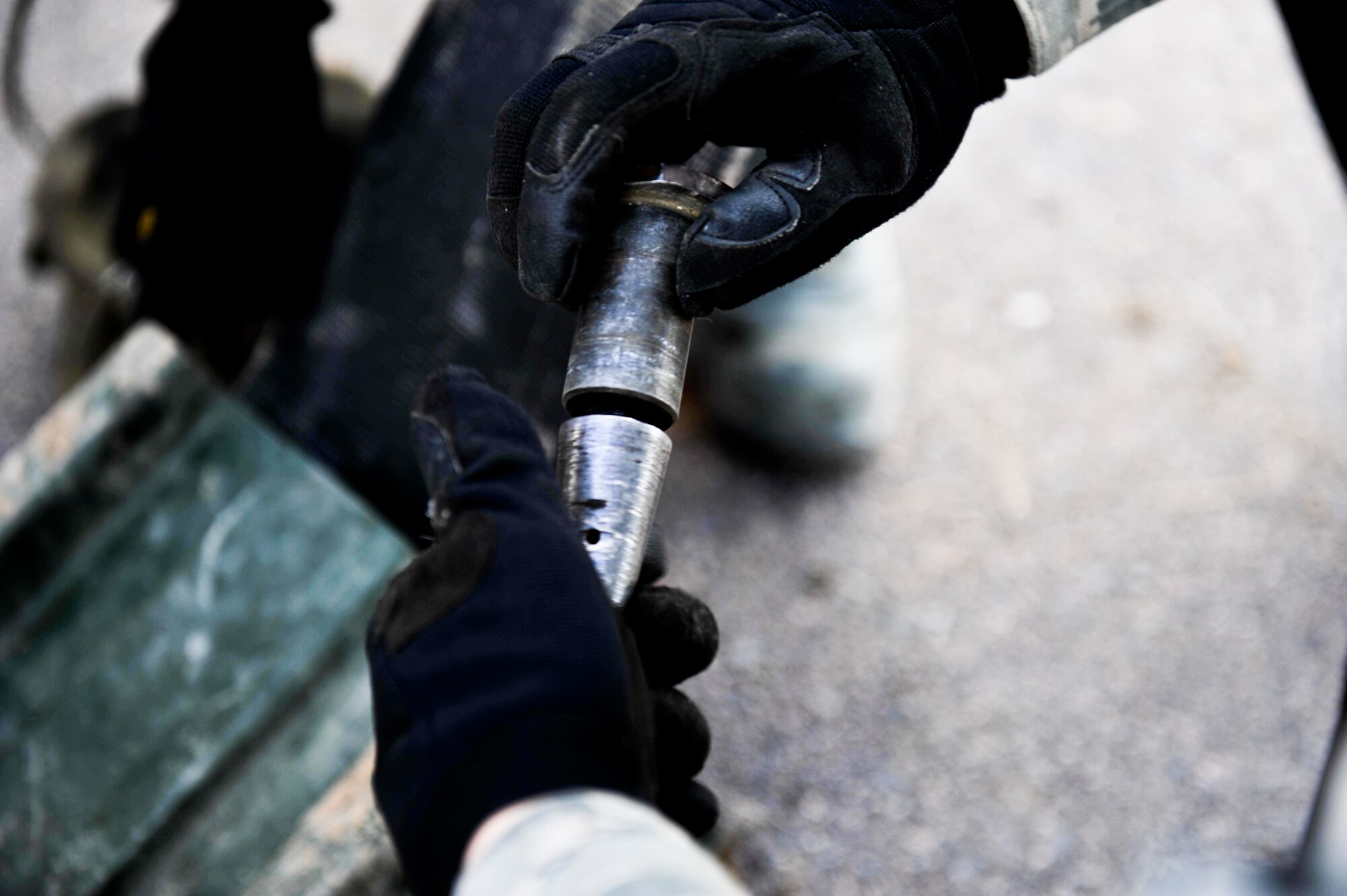 Senior Airman Vincent Poggiali, 200th RED HORSE, Ohio National Guard, assembles part of a Barrier Arresting Kit-12 system April 12, 2013, on the flightline at Buckley Air Force Base, Colo. Poggiali was one of eight Airmen from the 200th Rapid Engineer Deployable Heavy Operational Repair Squadron Engineers, who provided Buckley’s power production teams with manpower, assets and expertise in the assembly and installation of two BAK-12 systems. (U.S. Air Force photo by Airman 1st Class Riley Johnson/Released)