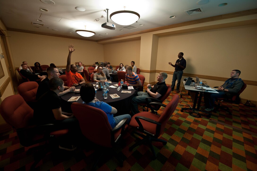 Ellsworth Airmen participate in a group discussion as part of a spiritual resiliency course called “Boundaries in Dating” during a singles retreat in Denver, April 6, 2013. During the course, instructed by Capt. Henry Jenkins and Staff Sgt. Christopher Flavin, 28th Bomb Wing Chapel staff, every Airmen learned how to better understand their role in creating positive, healthy relationships. (U.S. Air Force photo by Airman 1st Class Zachary Hada/Released)