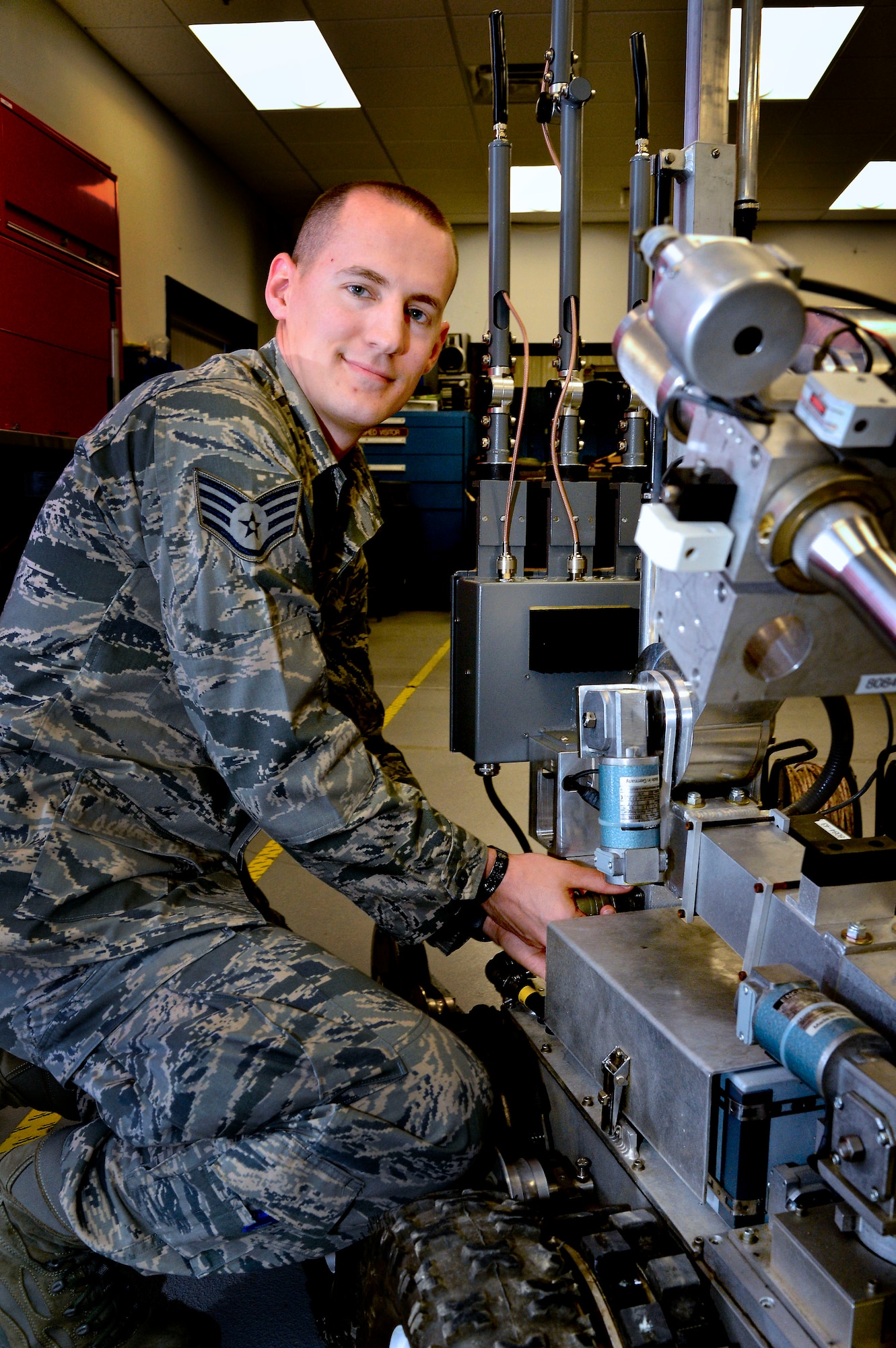 Staff Sgt. Benjamin McGovern of the 436th Civil Engineering Squadron EOD Flight, demonstrates the F6A Robot used by he and his team to render explosives safe at Dover Air Force Base, Del.,  April 16, 2013. Dover Air Force Base, hosted an Explosive Ordnance Disposal media day.  (U.S. Air Force photo/David S. Tucker)

