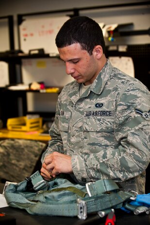 Airman 1st Class Anthony Silva, U.S. Air Force Weapons School aircrew flight equipment apprentice, conducts an inspection on a flight harness April 15, 2013, at Nellis Air Force Base, Nev. Life support performs routine inspections to ensure aircrew flight equipment is in mission-ready use. (U.S. Air Force photo/Senior Airman Brett Clashman)