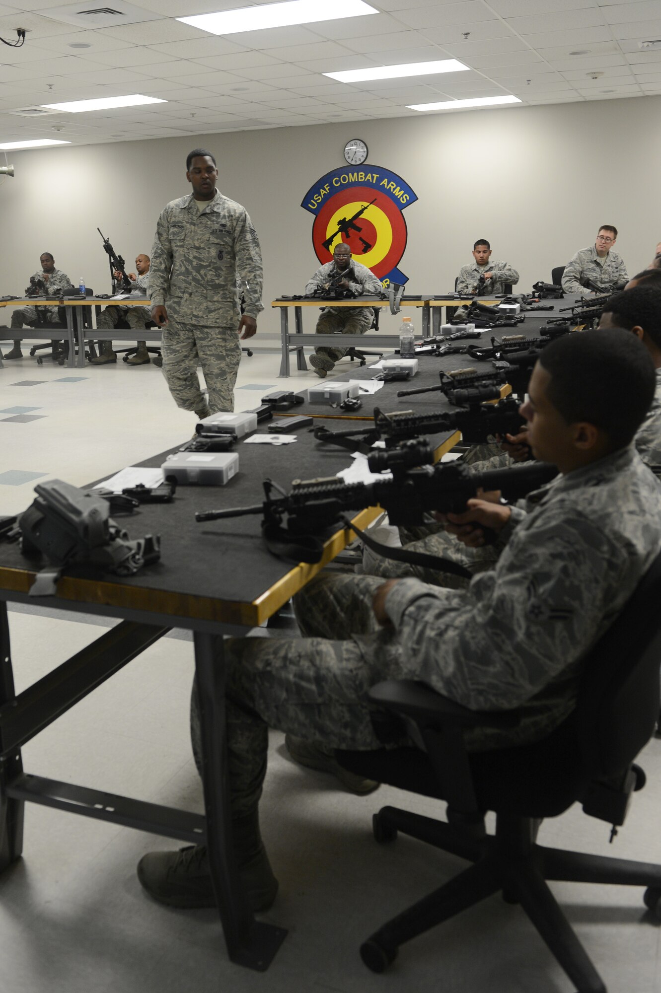 Staff Sgt. Norman Charlton, 20th Security Forces Squadron combat arms training instructor, trains members of security forces on the M-4 carbine at Shaw Air Force Base, S.C., April 10, 2013. Members of security forces carry various types of equipment to properly perform their job to include items such as handcuffs, seat belt cutters, a handheld radio, a flashlight, a whistle, a primary weapon which can be an M-9 pistol or an M-4, and a secondary weapon which can be an ASP baton, oleoresin capsicum pepper spray or a taser. Items like their primary weapons require regular training to stay certified. (U.S. Air Force photo by Airman 1st Class Krystal M. Jeffers/Released)