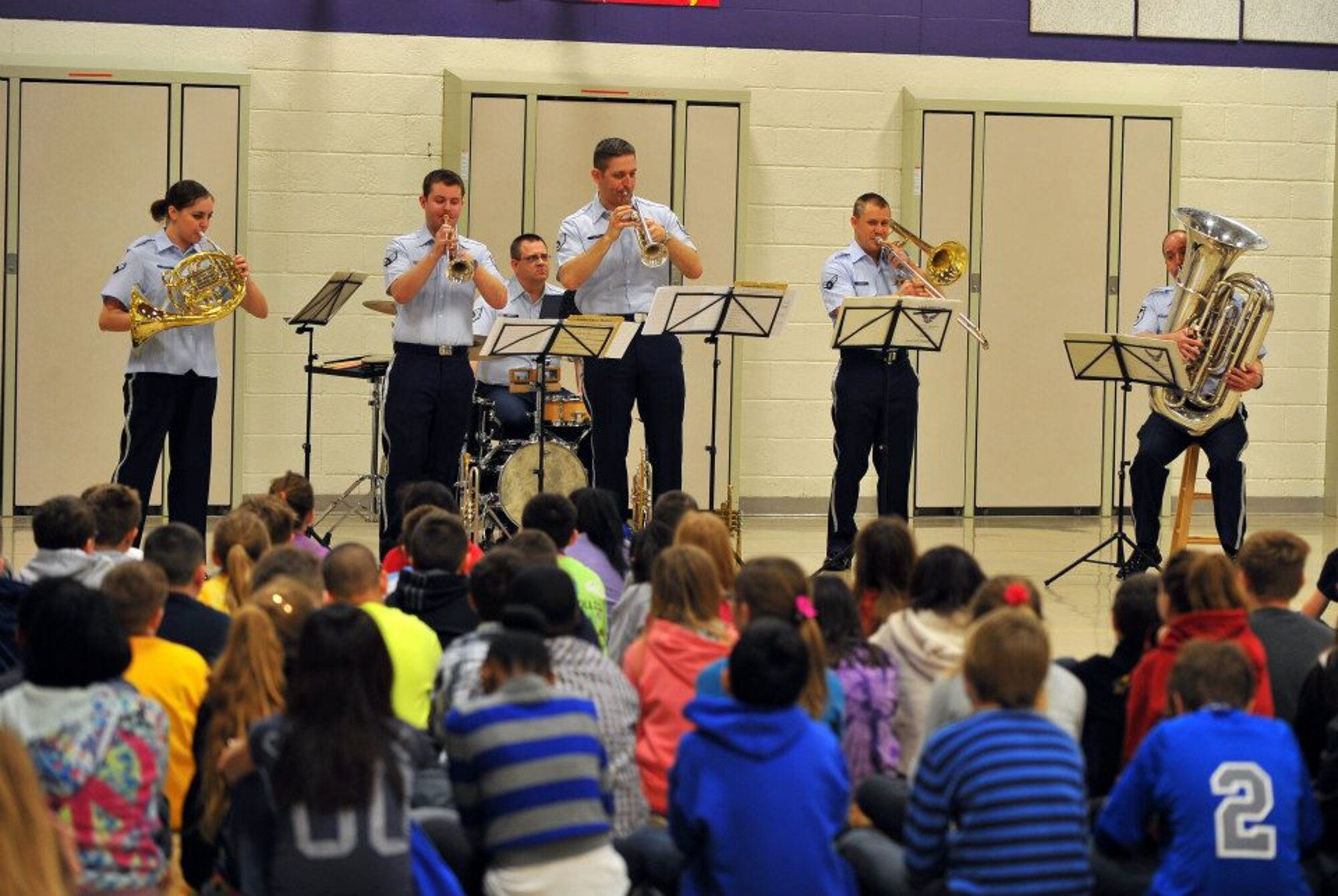 Offutt Brass performs for local elementary school students