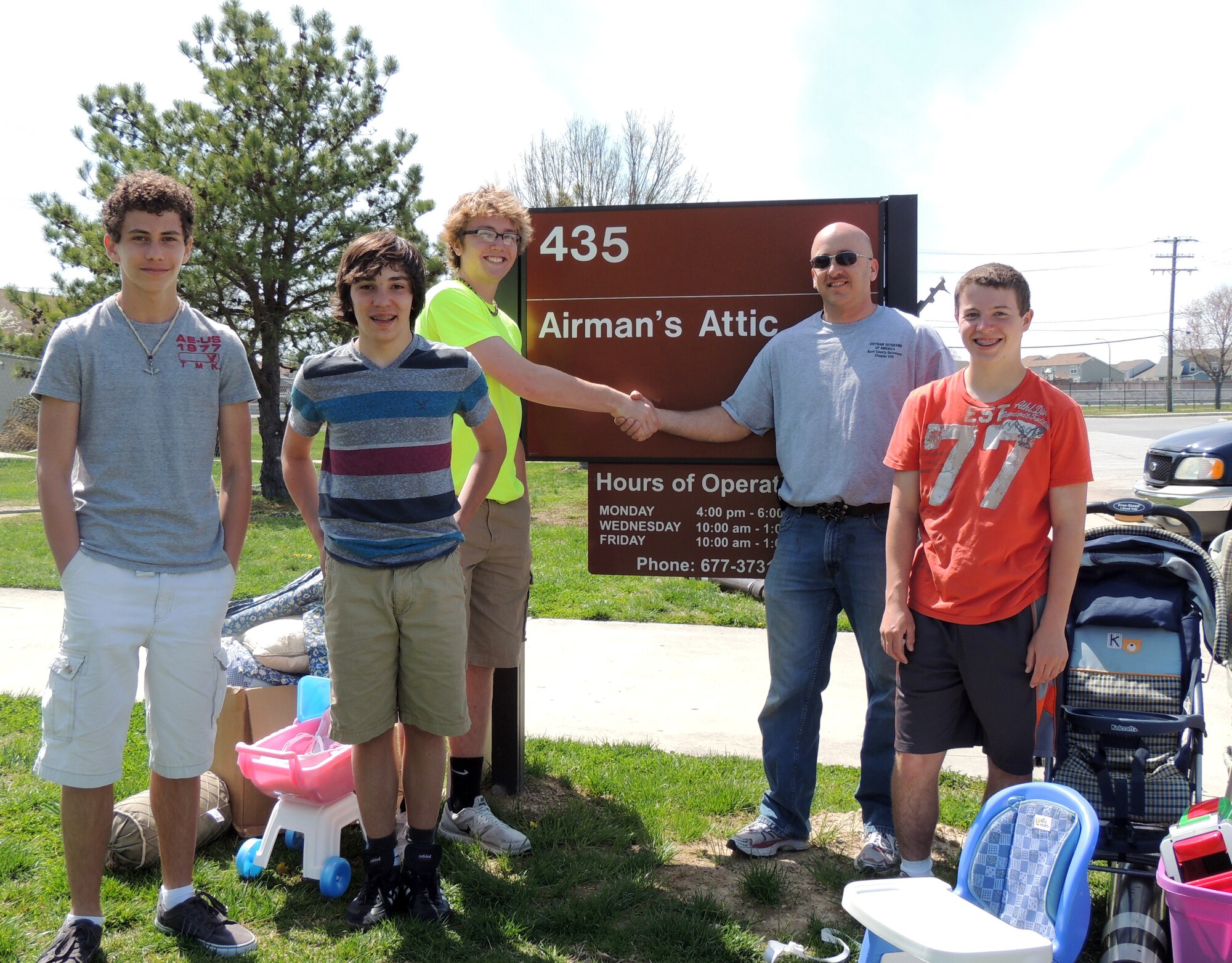 Master Sgt. Donald Tresler, 436th Logistics Readiness Squadron First Sergeant, receives five truckloads of donated goods to the Airman’s Attic on Dover Air Force Base, Del. The goods were from a drive held by the Orchards and Hunters Ridge Leadership Group, which  is a group of high school freshmen doing community service projects. The goods will benefit families at Dover AFB who are in need of household items. Also in the picture are Colin Cregan, Josh McNulty, Danny Noel and Adam Ahern.  Not pictured is Sean O’ Neill. (Courtesy photo)