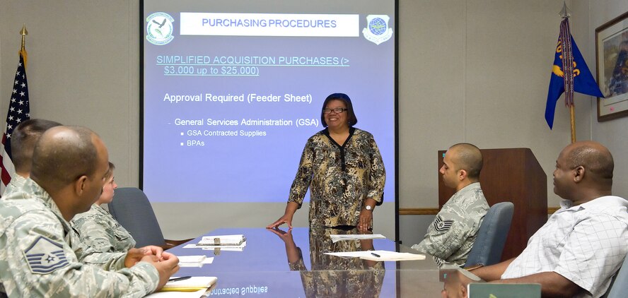 Lenore Brock, standing, 436th Contracting Squadron base government purchase card program manager, trains newly assigned GPC cardholders April 16, 2013, on Dover Air Force Base, Del. Brock provides classroom training for GPC card holders, approving officials and alternate approving officials prior to them receiving a GPC card.
 (U.S. Air Force photo/Roland Balik)

