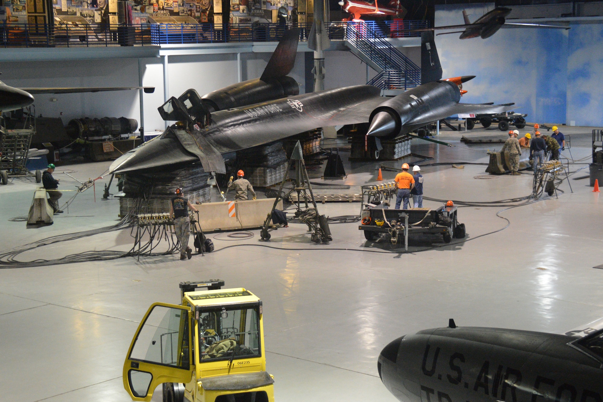 A team of Robins aircraft crash recovery personnel completes an annual exercise April 5 to raise the SR-71 Blackbird into a nose-up “take off’ position in the Museum of Aviation’s Century of Flight Hangar. (U. S. Air Force photo by Ed Aspera/Released)