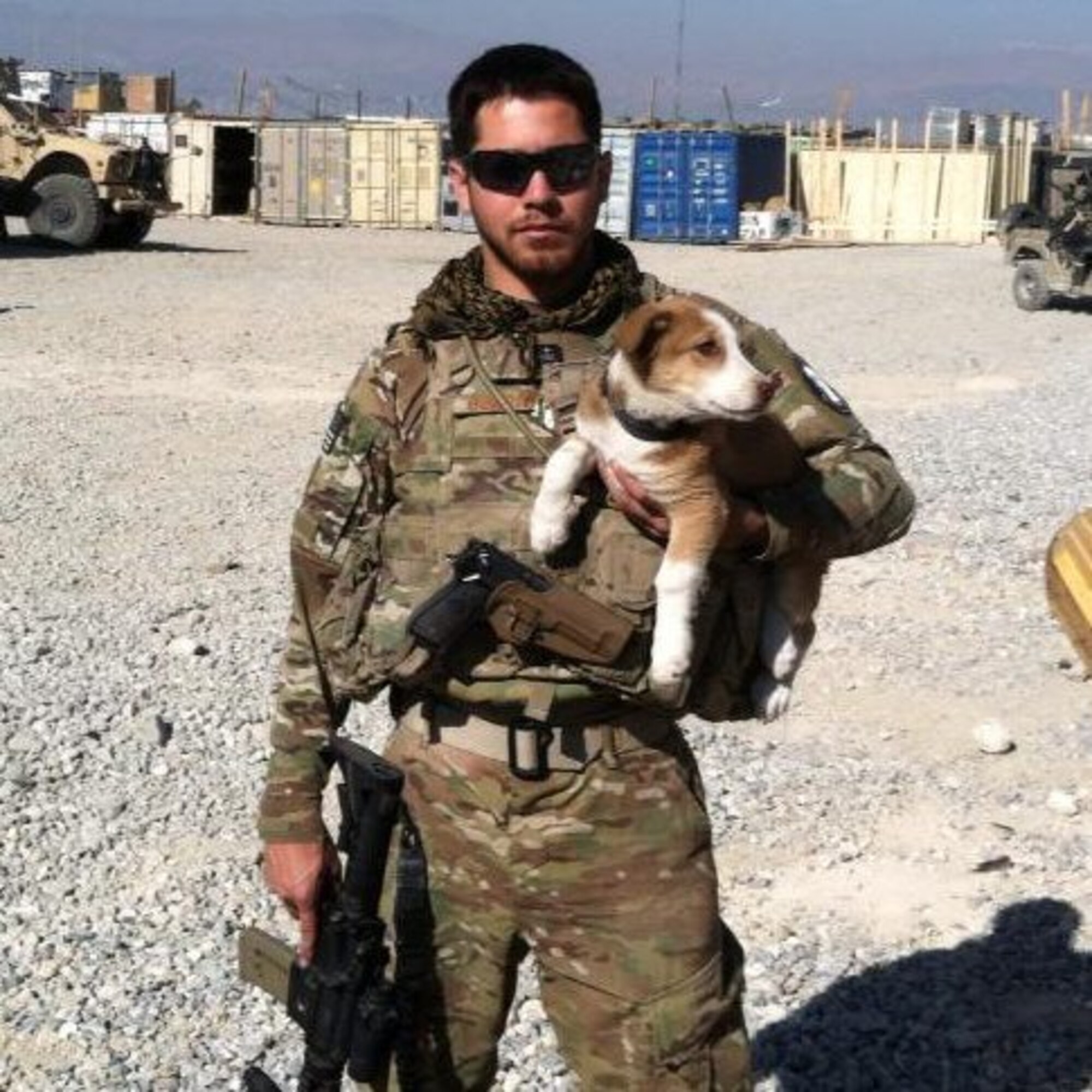 Staff Sgt. Thomas Burright, 7th Logistics Readiness Squadron, poses for a photo with his dog Lyla during his recent deployment to Afghanistan. Embedded as a vehicle mechanic with a unit of Army Green Berets, Burright was the only Air Force servicemember stationed at their outpost. (Courtesy photo)