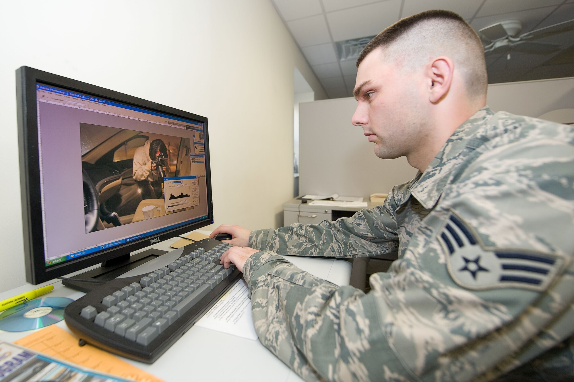 Senior Airman Jarod Duhon, 436th Airlift Wing Public Affairs photojournalist, edits photos taken during alert photography training to complete the simulated job. Duhon and others from the 436th and 512th Airlift Wing's undertook specialized training to prepare them to respond to alert and investigative response photography needs at Dover Air Force Base, Del. recently. After completing classroom portions of the training, each person was sent to respond to a staged accident/crime scene and tasked with fully documenting and processing the imagery for later use. (U.S. Air Force photo/Greg L. Davis)
