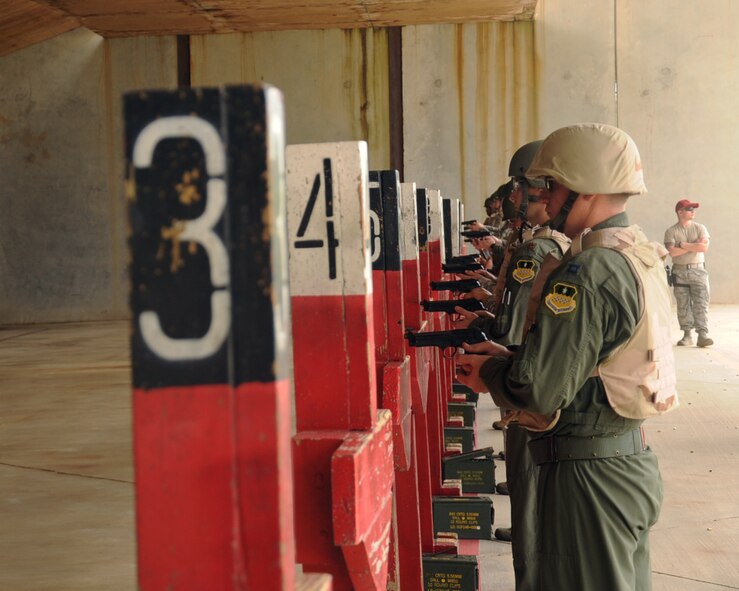 Airmen attending the M-9 Air Force Qualification Course prepare to fire on Barksdale Air Force Base, La., April 16, 2013. The class consists of two parts, a classroom and a hands-on session. (U.S. Air Force photo/Senior Airman Sean Martin)