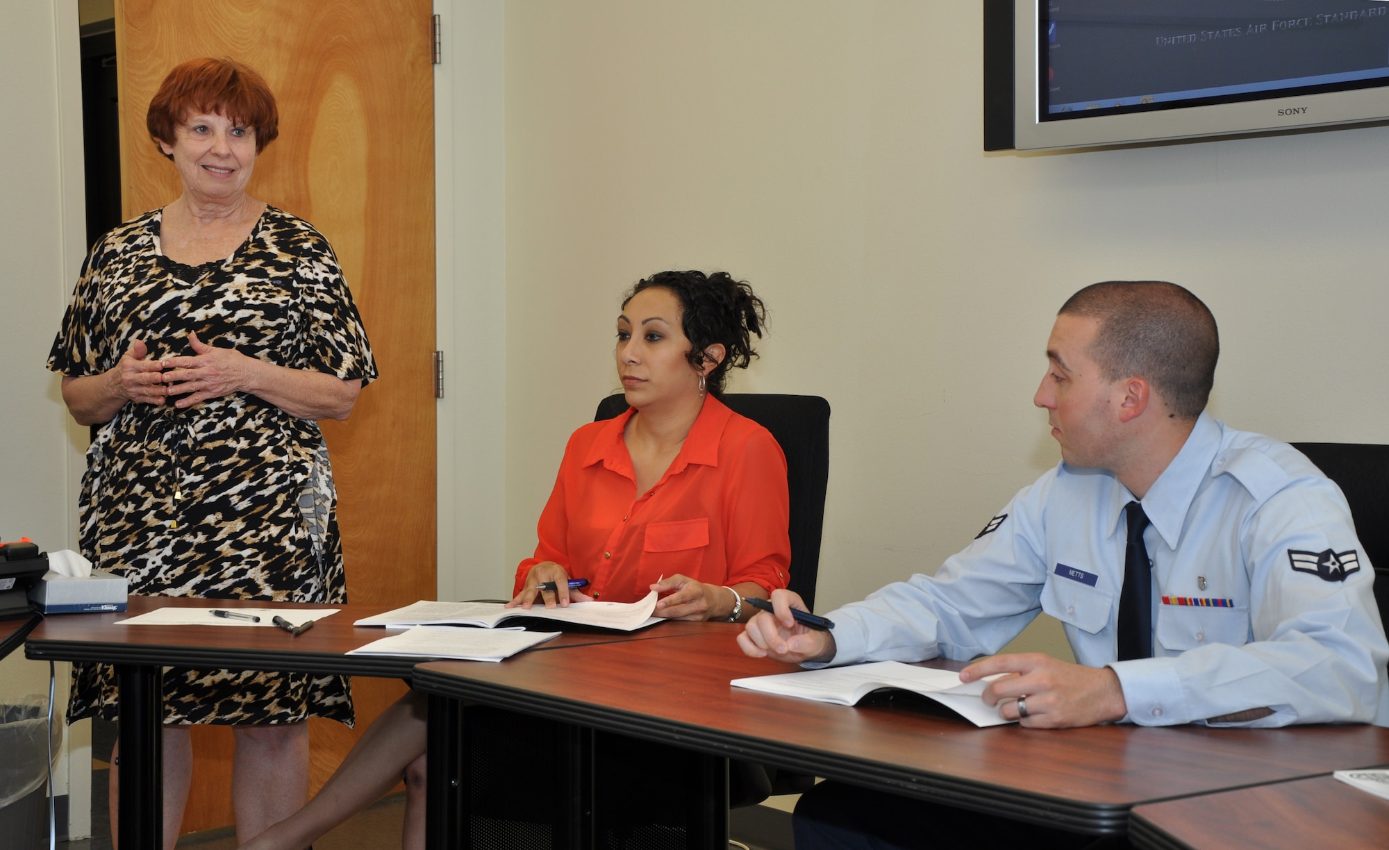 GOODFELLOW AIR FORCE BASE, Texas - Karen Bartholomeo, 17th Family Advocacy Outreach manager, teaches Adrienne Damion, 17th Mental Health family advocacy nurse, and Airman 1st Class Charles Metts, 17th Mental Health technician, about the first module of the Love and Logic class at the 17th Mental Health Clinic, here, April 15. This portion of Love and Logic taught individuals the type of parent they are and how to handle their children. (U.S. Air Force photo/ Airman 1st Class Joshua Edwards)