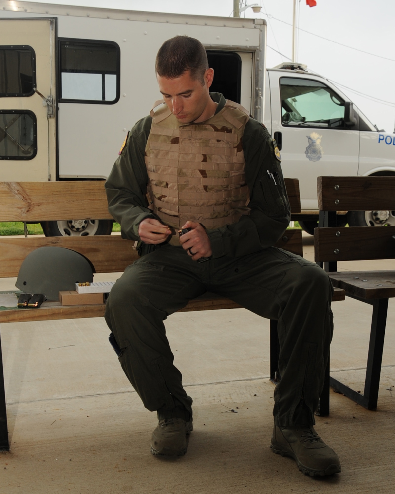 Maj. Adam Newell, 2nd Aerospace Medical Squadron flight surgeon, loads rounds into a magazine during an M-9 Air Force Qualification Course on Barksdale Air Force Base, La., April 16, 2013. Airmen are given 90 rounds to shoot. Half the rounds are used for practice and the other half are used for qualification. (U.S. Air Force photo/Senior Airman Sean Martin) (RELEASED)