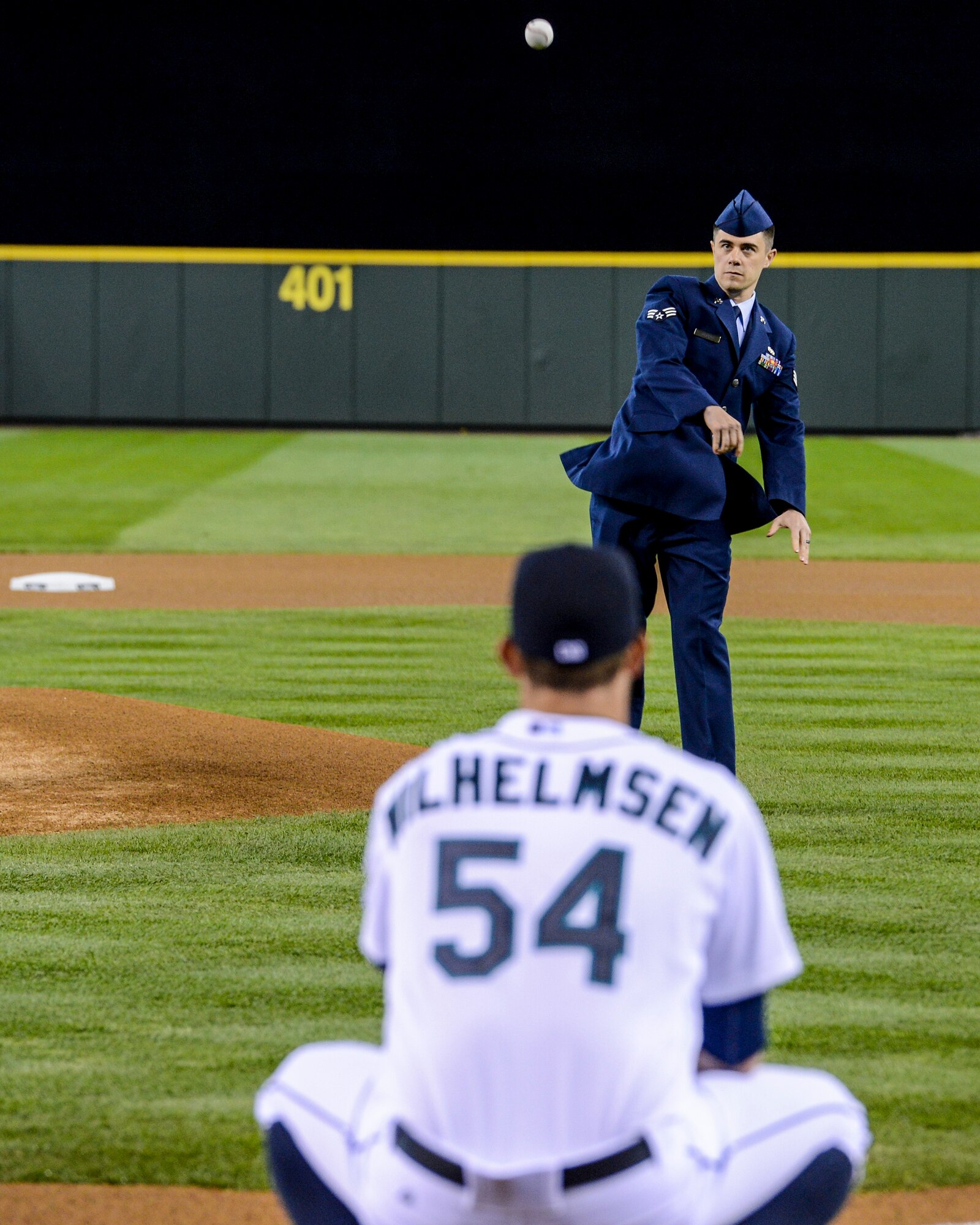 Senior Airman Anthony Haupert, 62nd Aircraft Maintenance Squadron communication and navigation systems specialist, throws out the first pitch at a baseball game, April 13, 2013, at Safeco Field in Seattle, Wash. Haupert was selected by his leadership to represent the Air Force at the Mariner's 2013 Salute to Armed Forces Night. (U.S. Air Force photo/Tech. Sgt. Sean Tobin)