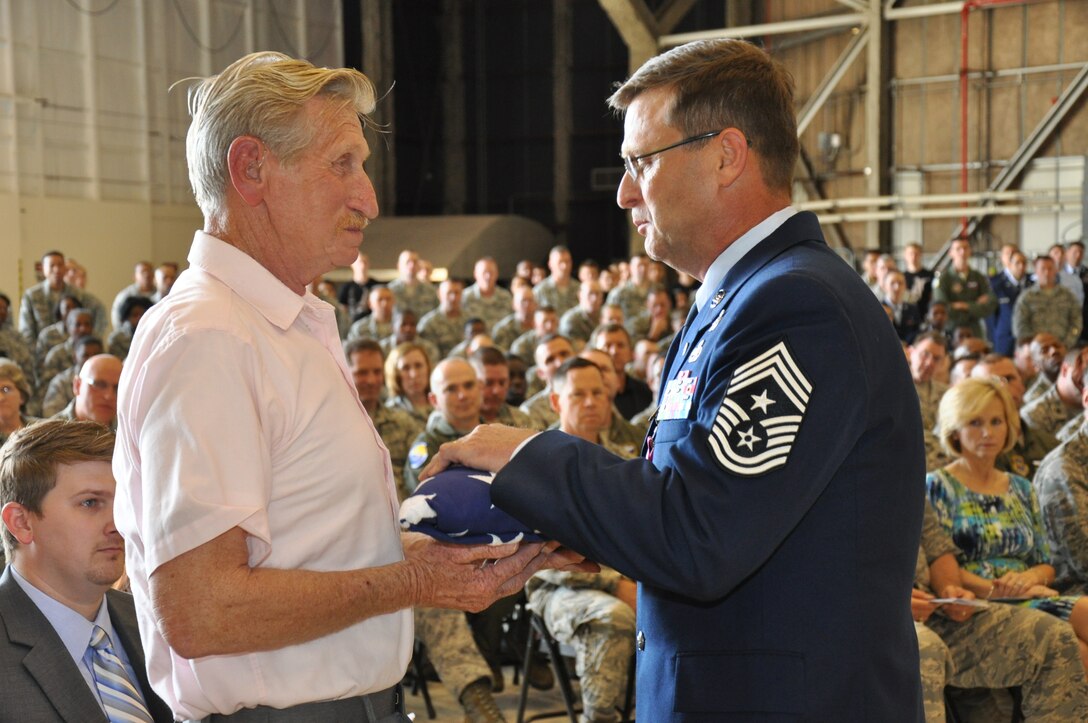 016th Air Refueling Wing Command Chief Master Sgt. Greg Nelson shares a moment with his father, Roger Nelson, during his retirement ceremony on April 13, 2013. Chief Nelson served 30 years. (USAF photo by Staff Sgt. Mark Thompson, 916ARW/PA)