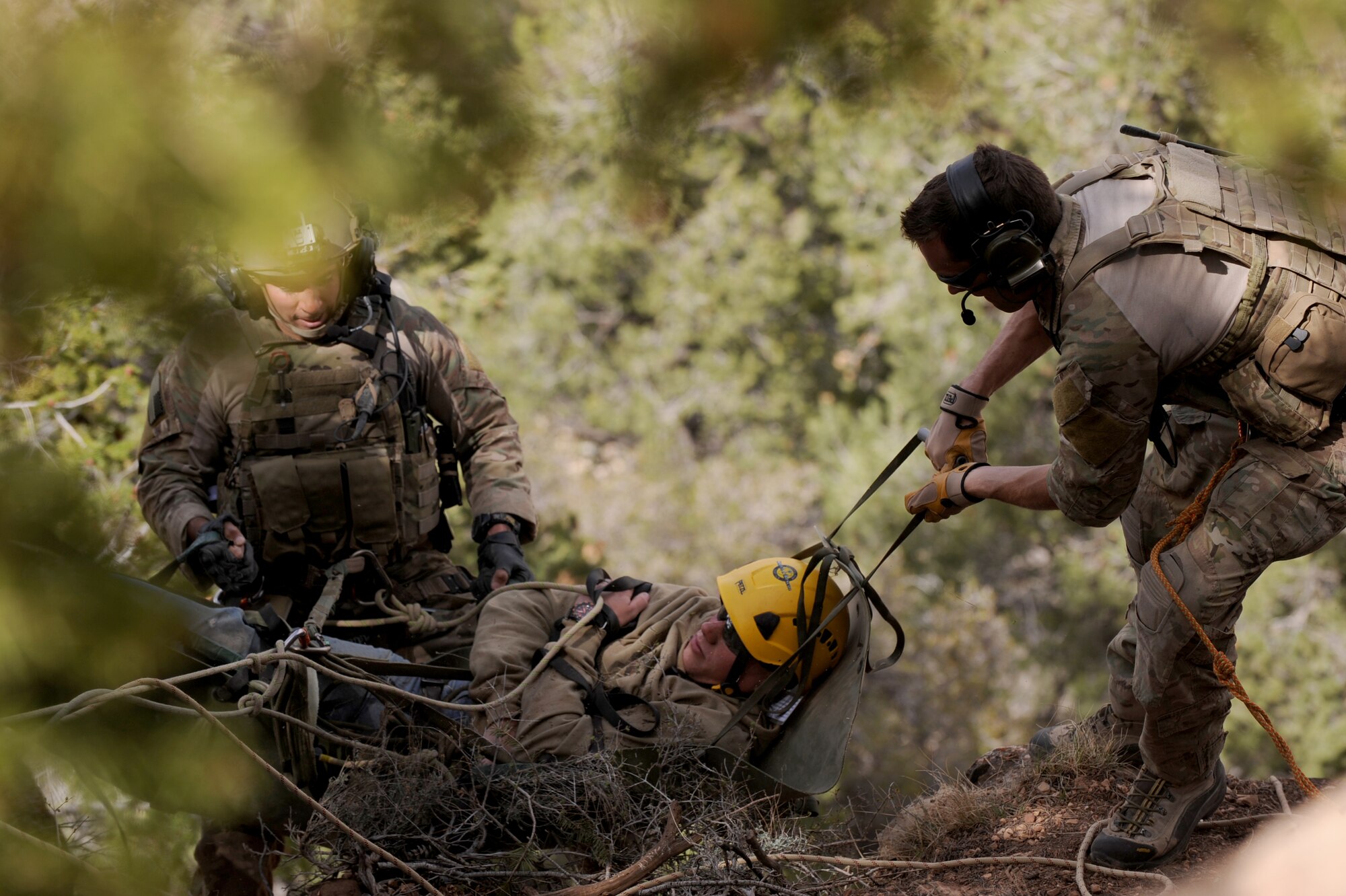 U.S. Air Force pararescuemen from the 58th Rescue Squadron, Nellis Air Force Base, Nev. rescue one of many simulated casualties as part of Angel Thunder at the Grand Canyon,  April 13, 2013. Angel Thunder provides personnel recovery and combat search and rescue training for combat aircrews, pararescue, intelligence personnel, battle managers and joint search and rescue center personnel. (U.S. Air Force photo by Airman 1st Class Christine Griffiths/Released)