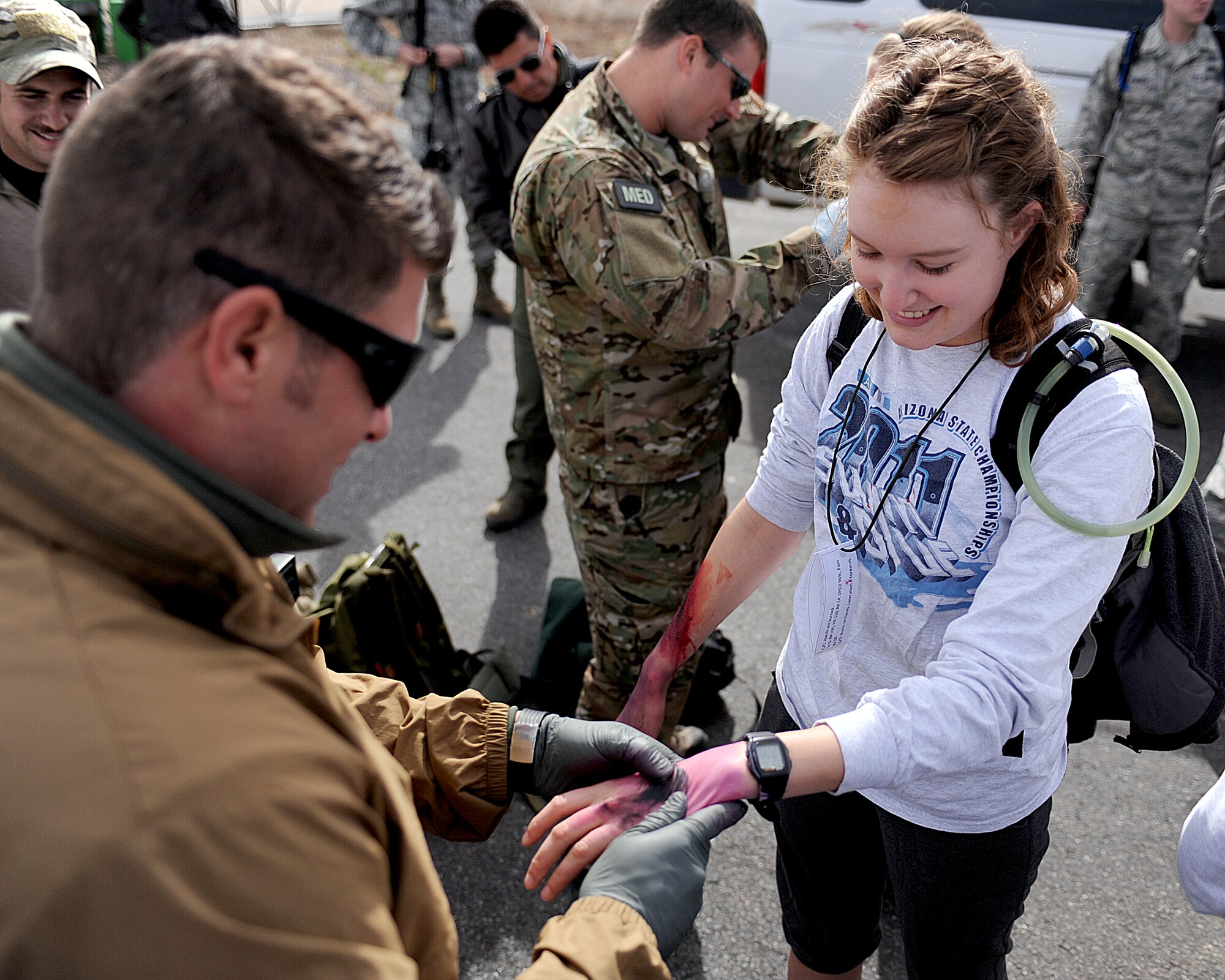 U.S. Air Force Tech. Sgt. Daniel Thetford, 48th Rescue Squadron, applies fake injuries to a Northern University of Arizona U.S. Air Force ROTC cadet prior to the high-angle rescue exercise at the Grand Canyon, Ariz., April 13, 2013. Approximately 25 cadets from NUA attended the Angel Thunder exercise. (U.S. Air Force photo by Airman 1st Class Christine Griffiths/Released)